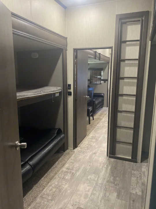 Bunk House with Beds #1  & #2 Sofa (folds down into bed (could sleep two full size) 
Access to Loft Bed #4 . Crossroads RV Volante 2019