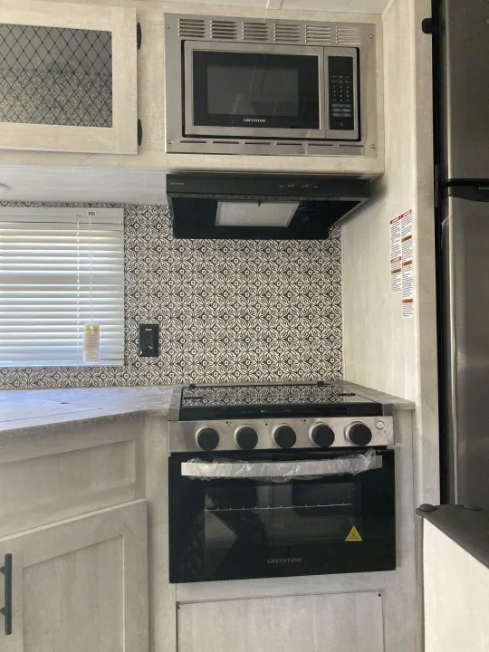 Stainless steel appliances for the kitchen . Shasta RV 310K 2022