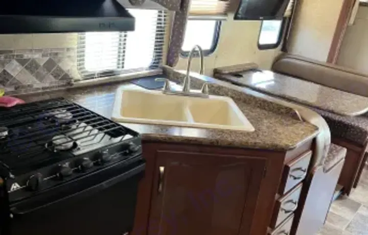 Corner sink and gas stove and oven, with hood. Thor Freedom Elite 2015
