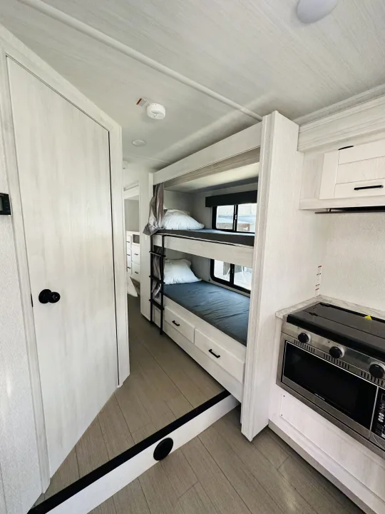 Bunk beds that have their own outlet and window (which is really rare!) Also both have a privacy curtain. . Forest River Other 2023