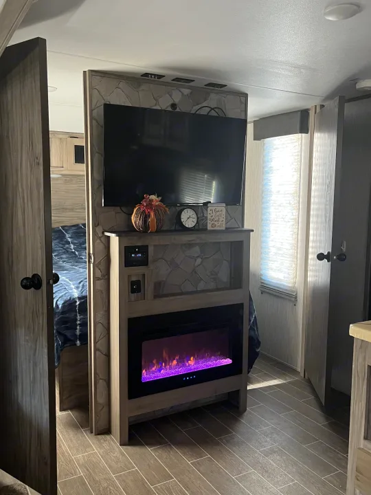 This fireplace can actually keep the entire camper warm but there is also central heat and air as well.. Forest River Cherokee Alpha Wolf 2021
