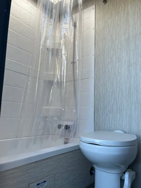 Shower and small tub. We always shower at the campground bath house to reduce trips to the dumping station.. Forest River Cherokee Alpha Wolf 2021