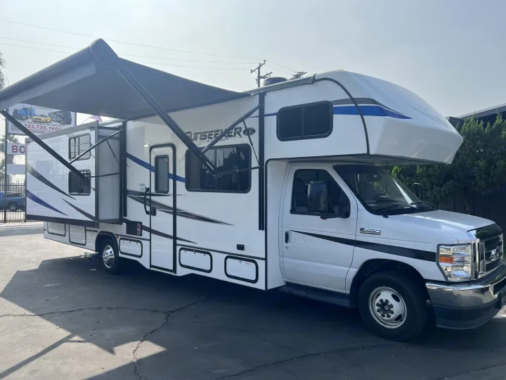 This pic model shows the unit in a complete layout ready to chill & have fun.

(bedroom slide out & machine operated awning, LED light and includes built in speakers on top edge corners for outside beats) . Forest River Sunseeker LE 2021