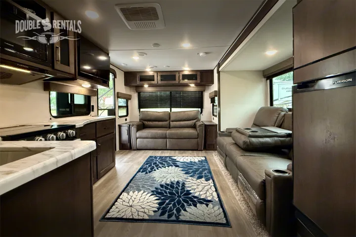 L-shaped kitchen, living area with 2 sofas. Grand Design Transcend 2023