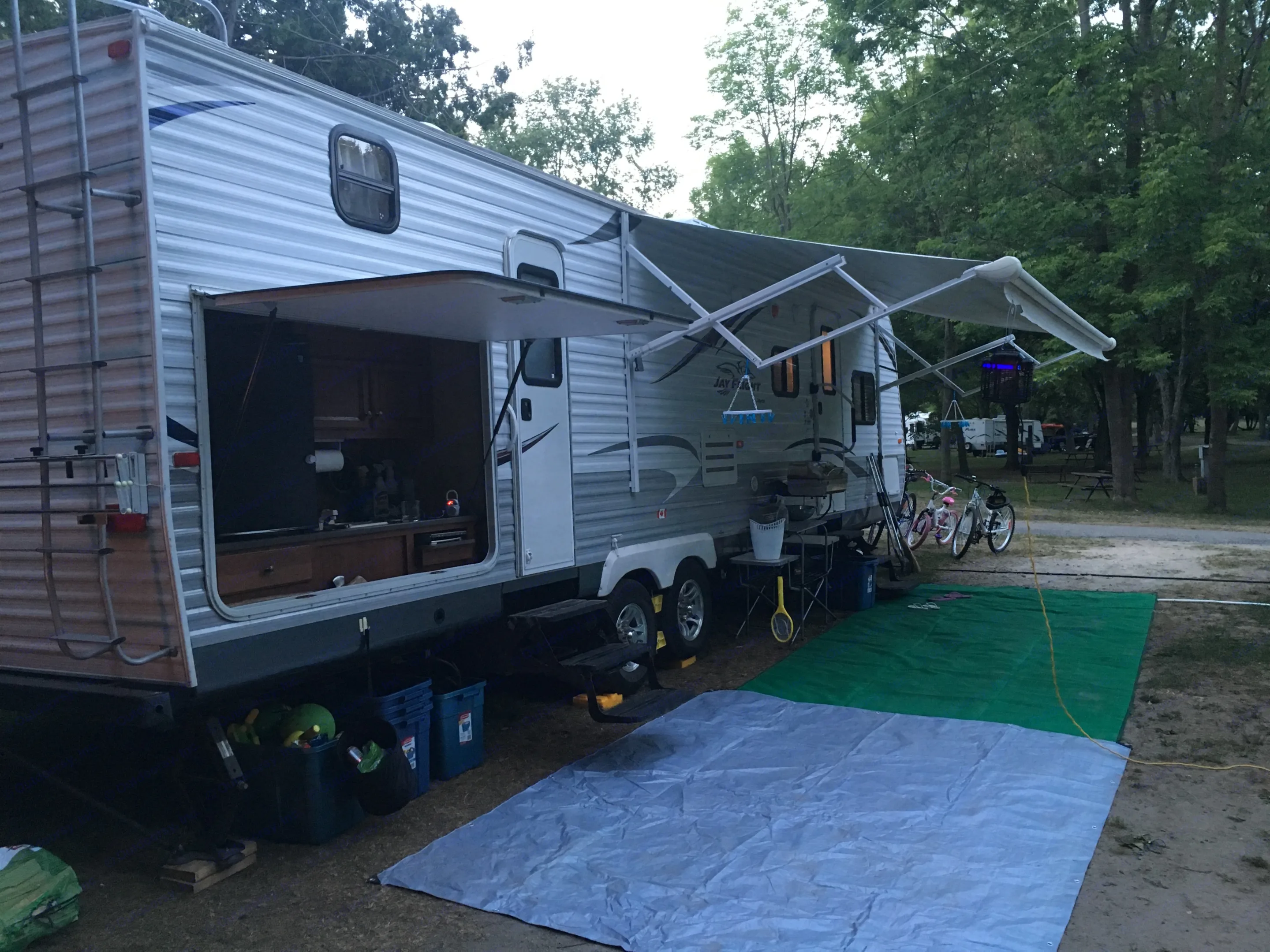 Exterior. Pictured are 2 entrances (one to the bathroom), and the outdoor kitchen.. Jayco Jay Flight 2012
