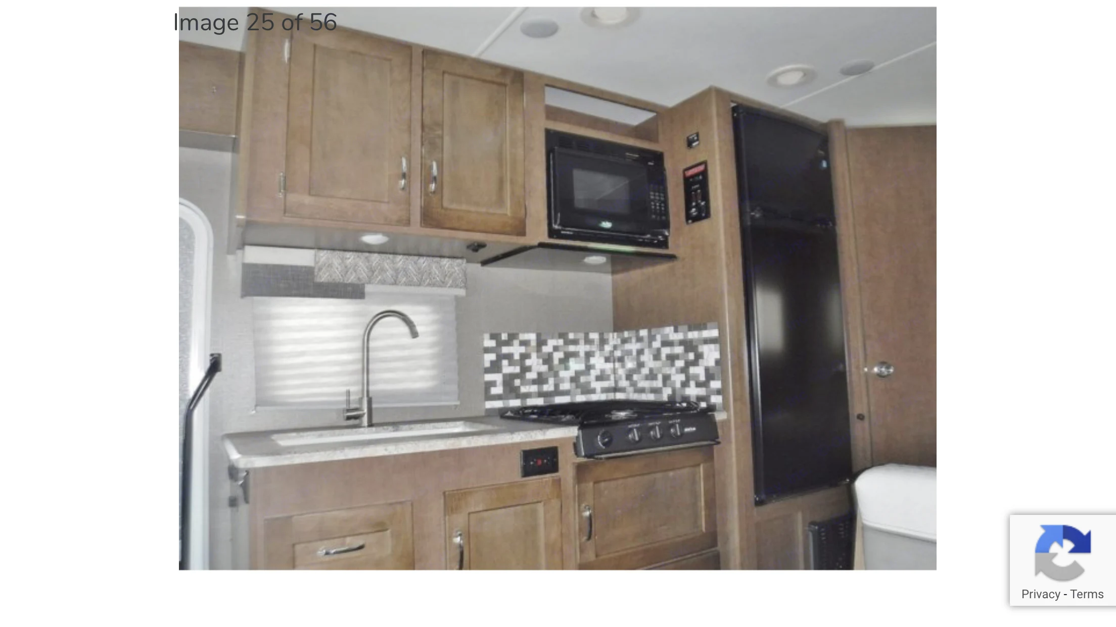 Kitchen, no stove, just stovetop. Love the backsplash and two compartment sink. Windows so you can look out if you get stuck doing dishes.. Winnebago Outlook 2019