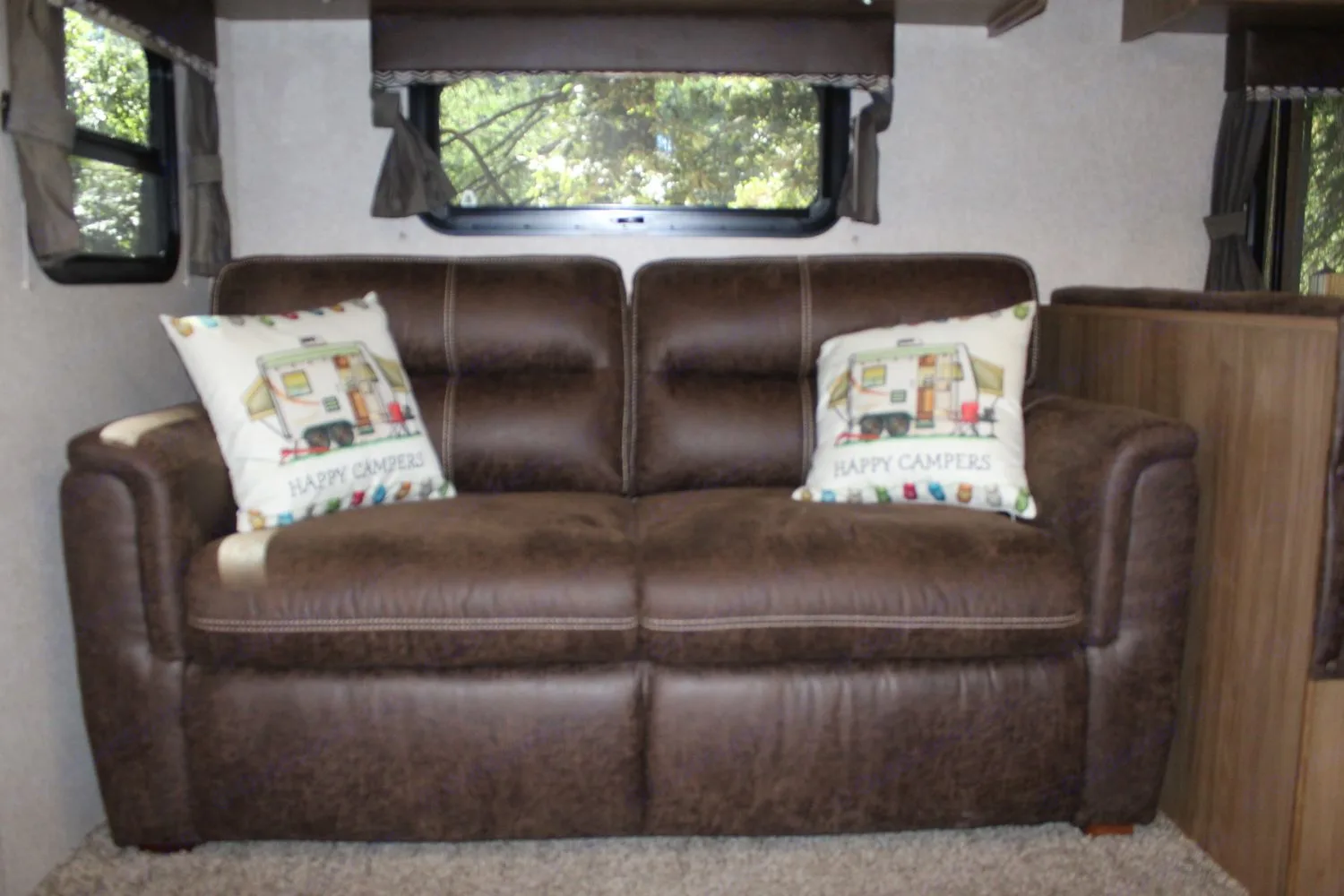 Sofa transforms into a sofa bed which is good for 1 adult, or 2 kids. Simple to open and close.. Forest River Rockwood Roo FL 2018