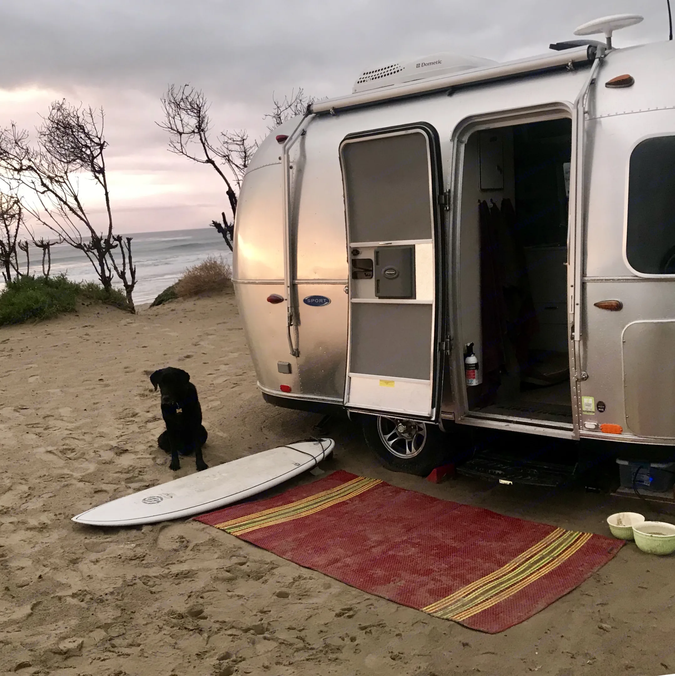 Besie and our dog Asha enjoying beach camping and adventures at Jalama. Airstream Sport 2016