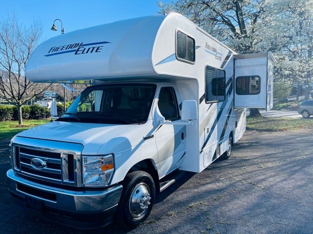 Motorized slideout provides large master bedroom. Thor Motor Coach Freedom Elite 2021