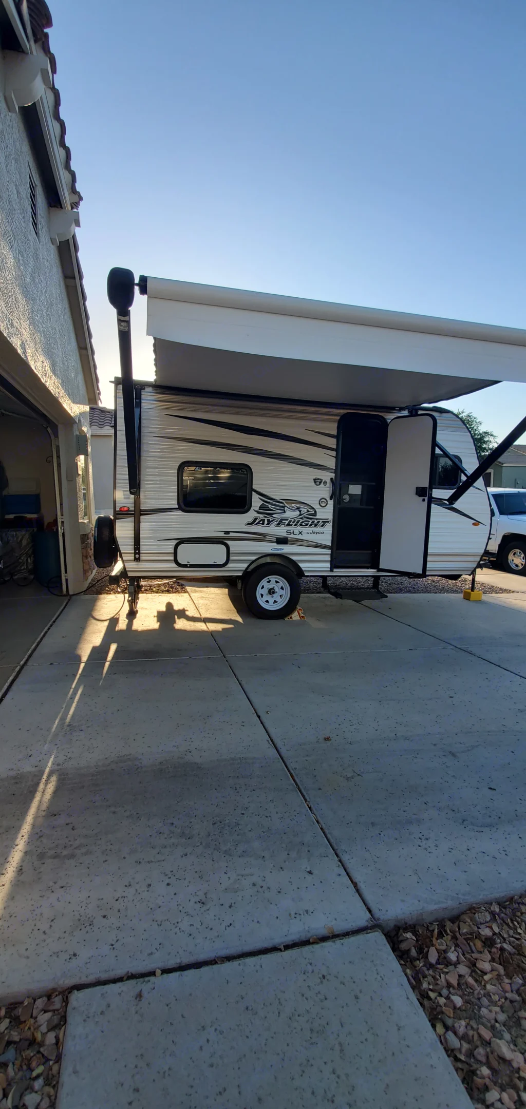 This Jayco travel trailer, an RV rental with its awning extended, is ready for your next adventure.. Jayco Jay Flight SLX 2018