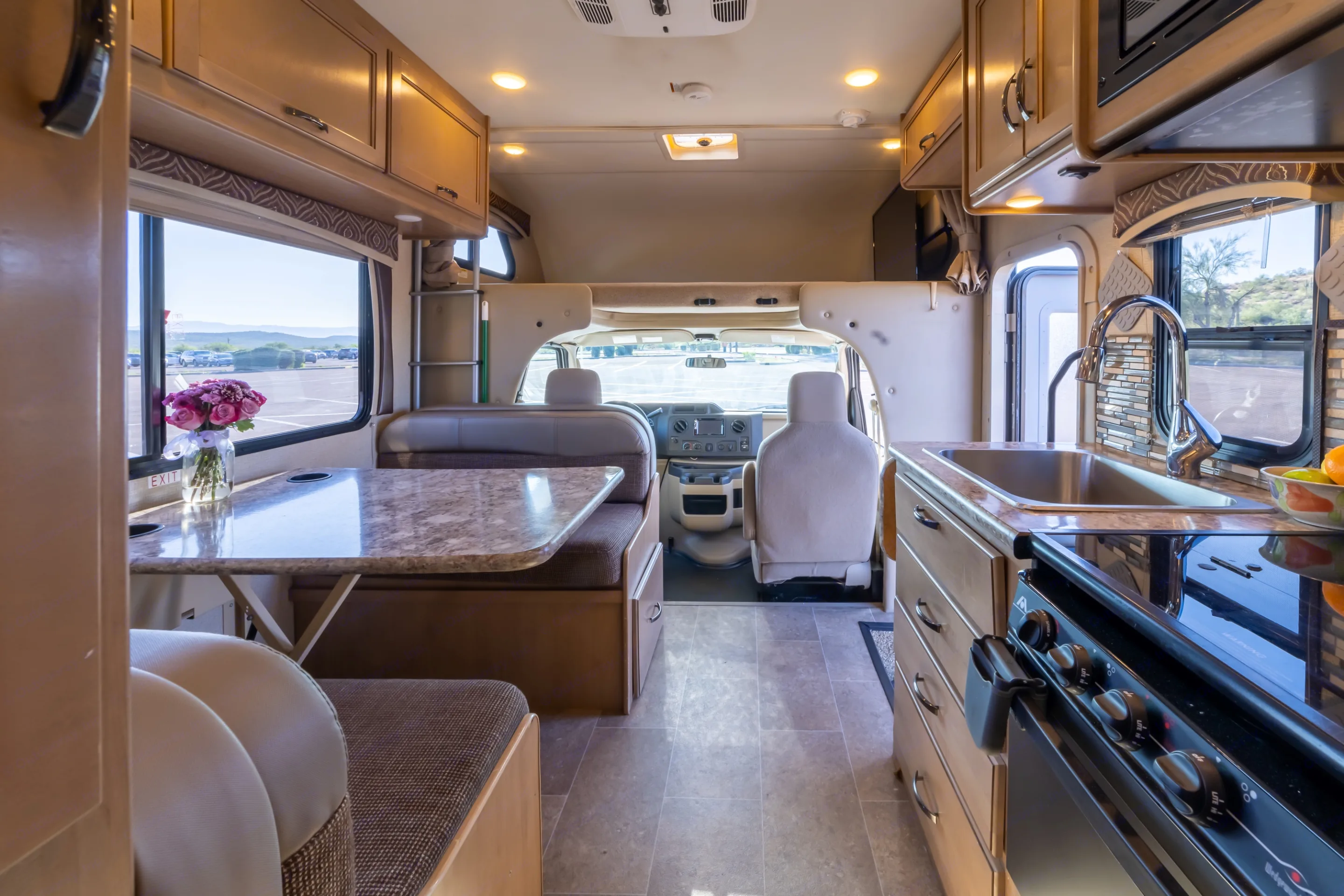 Comfortable interior gives campers all they need to cook, do dishes, entertain, and sleep a crew. . Thor Motor Coach Chateau 2018