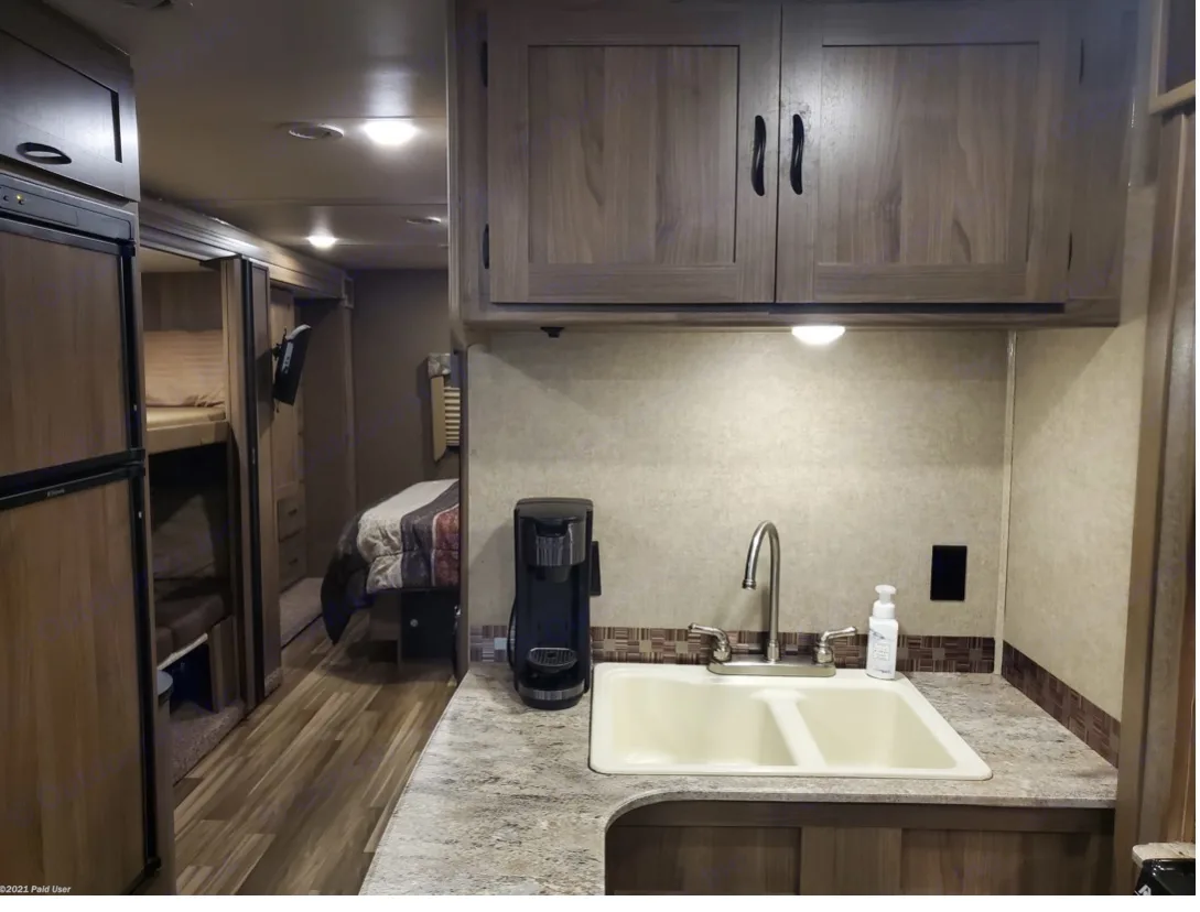 Full entertainment center across the hall with TV, DVD, and stereo with speakers . Coachmen Freelander 31BH 2017