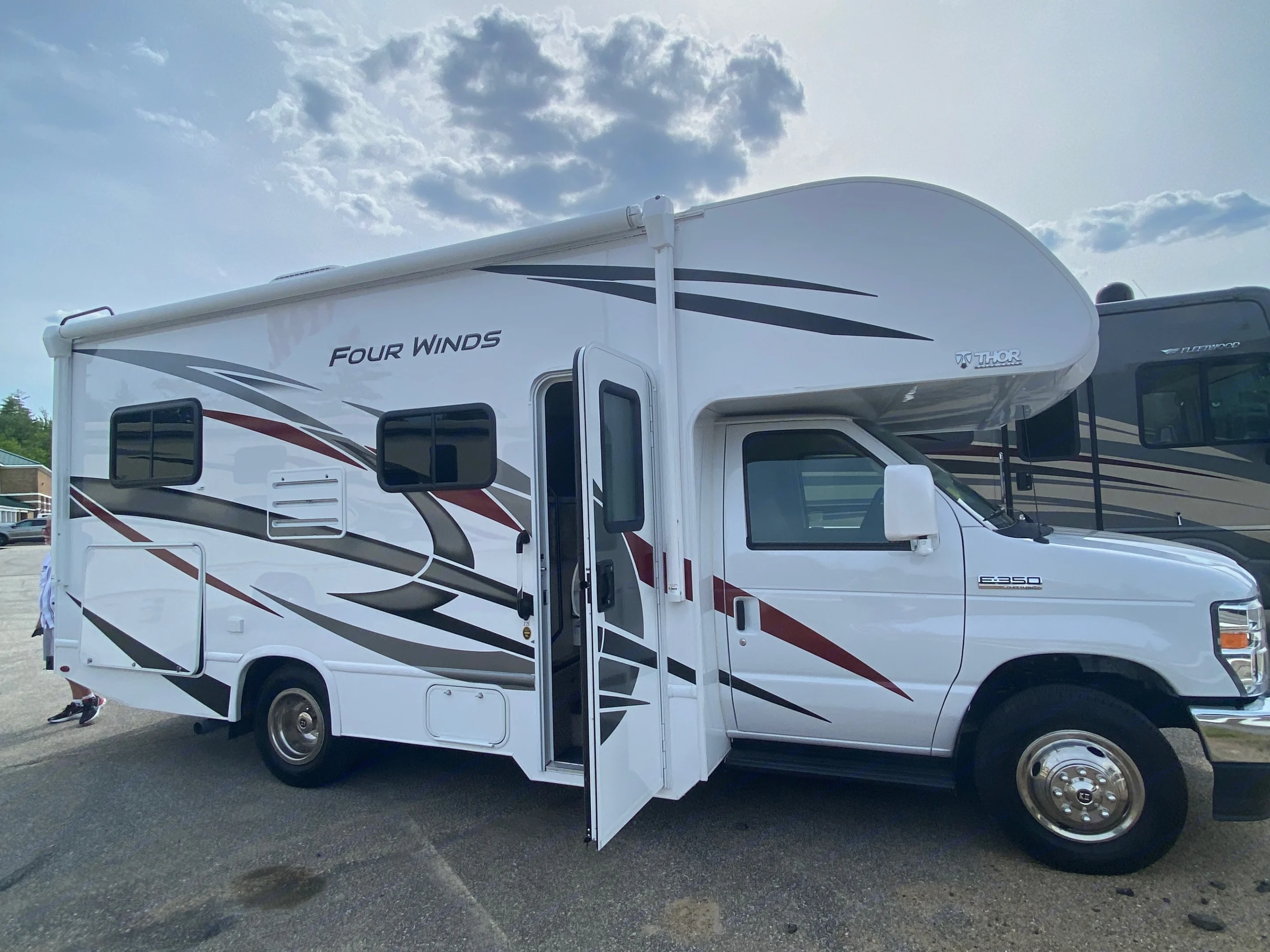 Passenger side with access door open. Thor Four Winds 2021