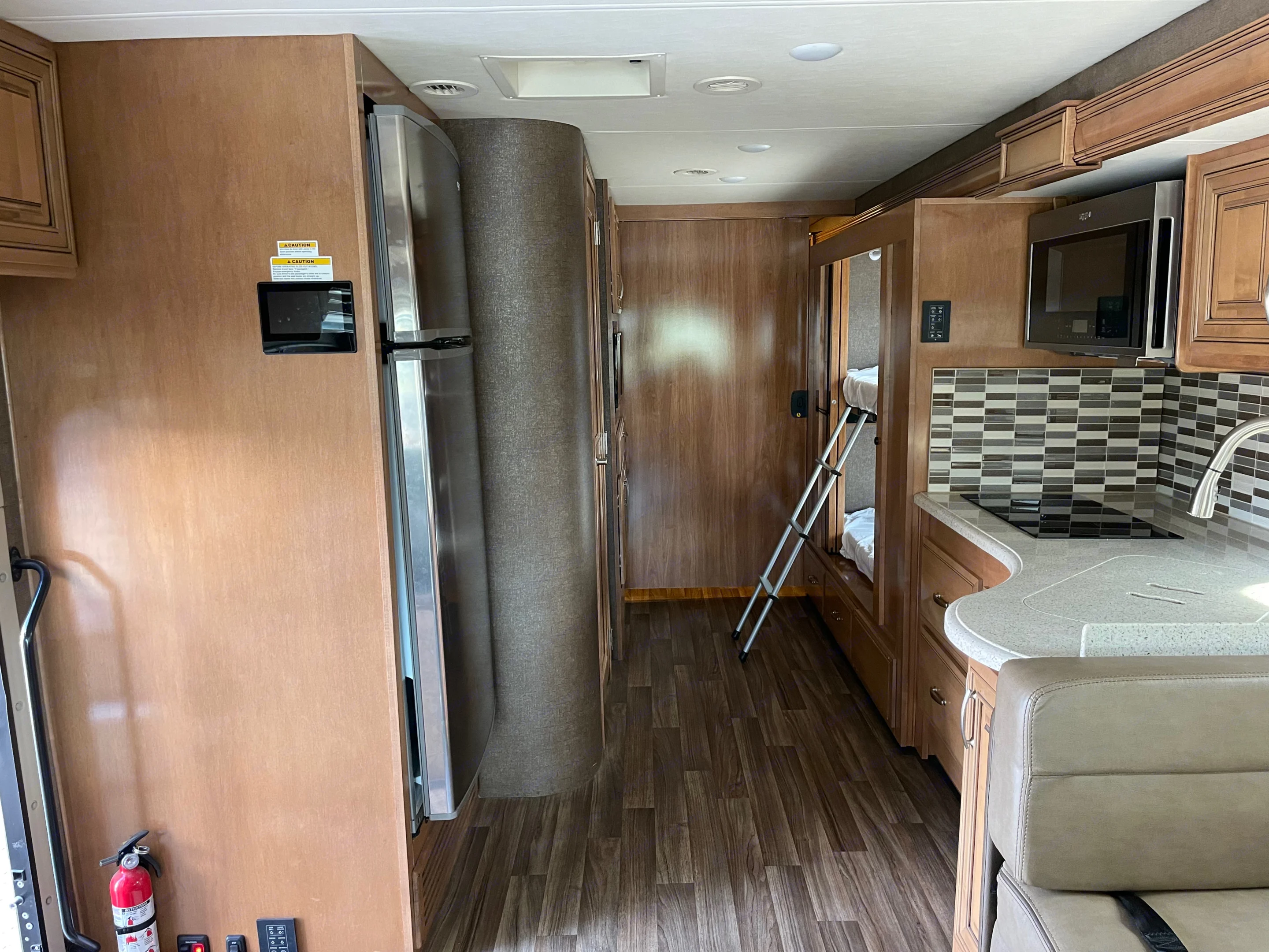 Back bedroom door closed. Bunkbeds (with doors). Residential sized fridge. B. Thor Palazzo 2019