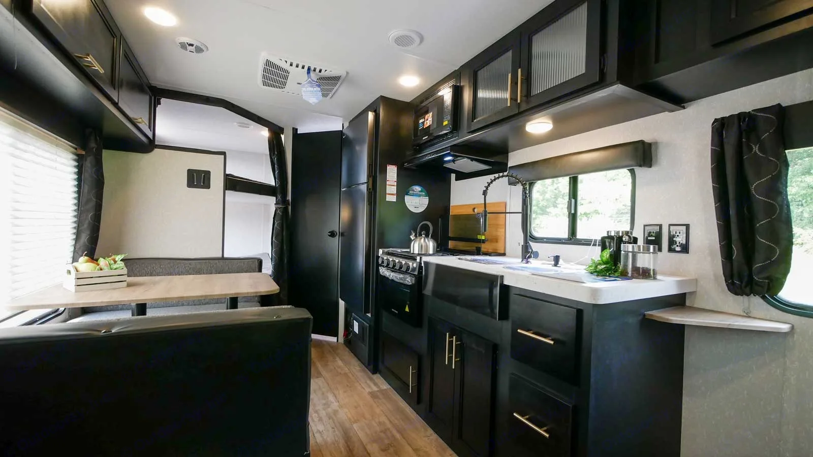 Full size refrigerator cools while driving down the road, three burner stove top, oven microwave and large sink.. Forest River Cherokee Grey Wolf Special Edition 2021