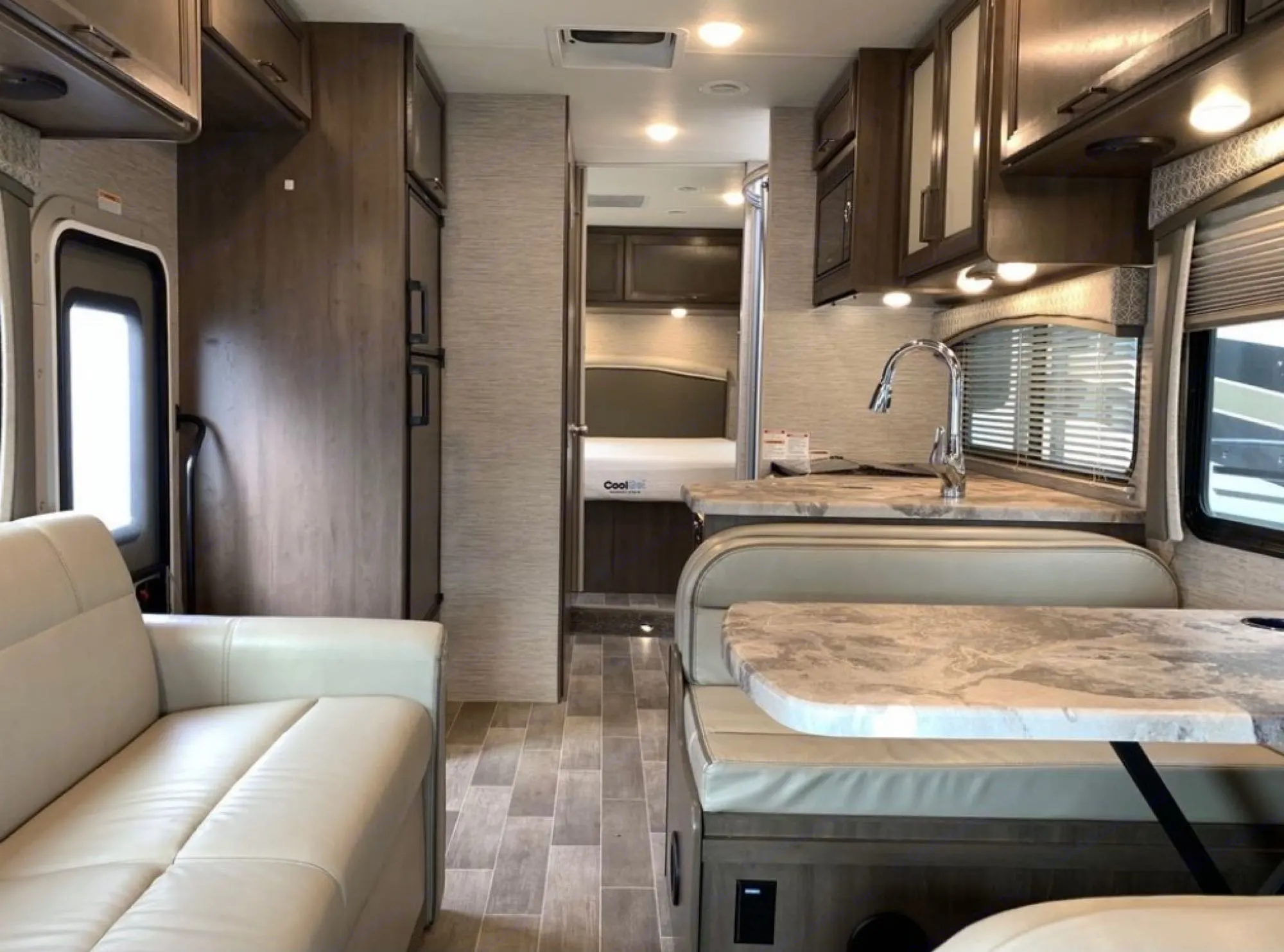 Spacious, modern RV rental interior with a well. Thor Motor Coach Chateau 2021