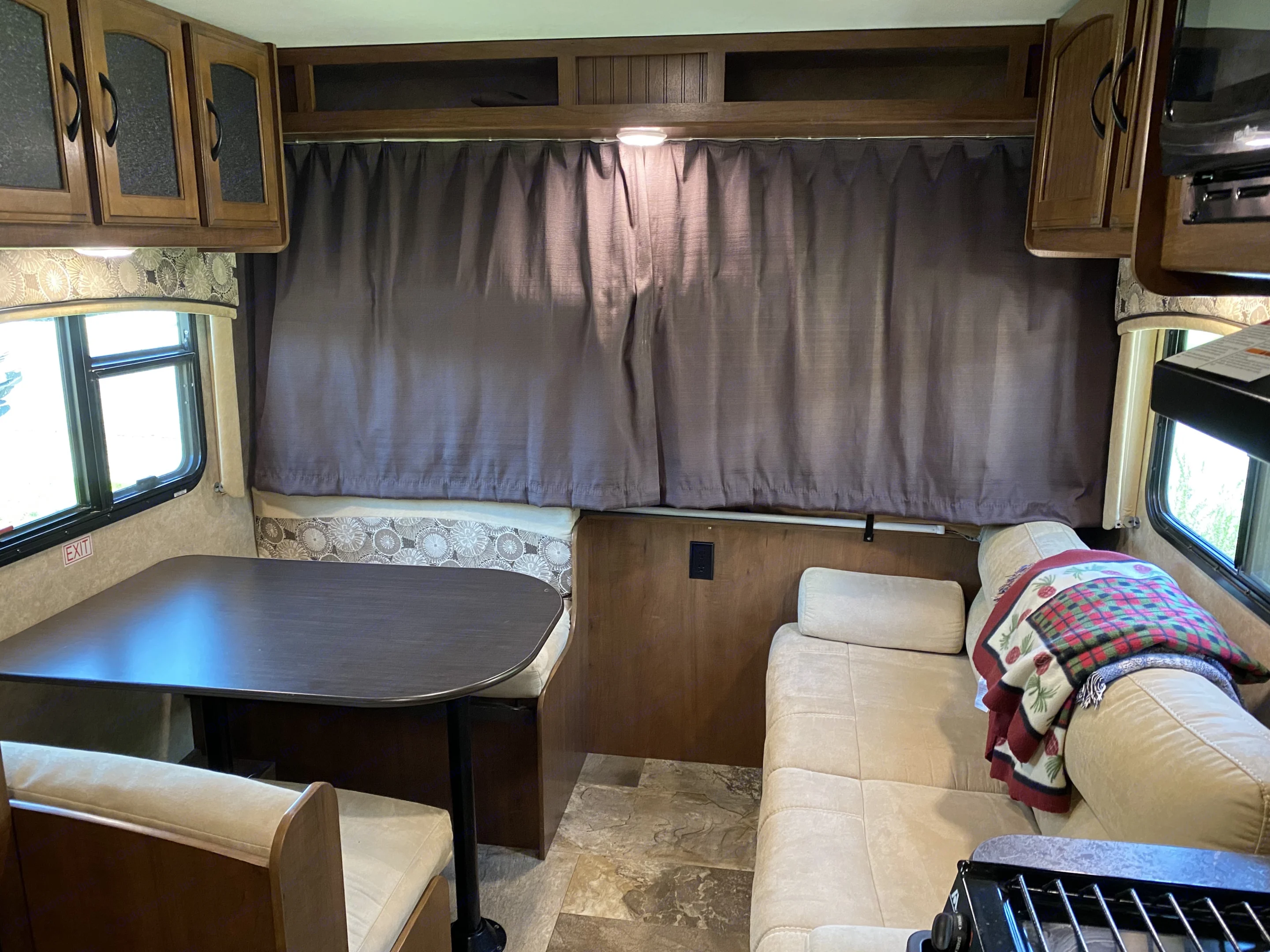 Looking forward from the entrance, you can see the dining and lounge area. The curtains open to the forward bedroom.. Jayco Jay Feather 2016