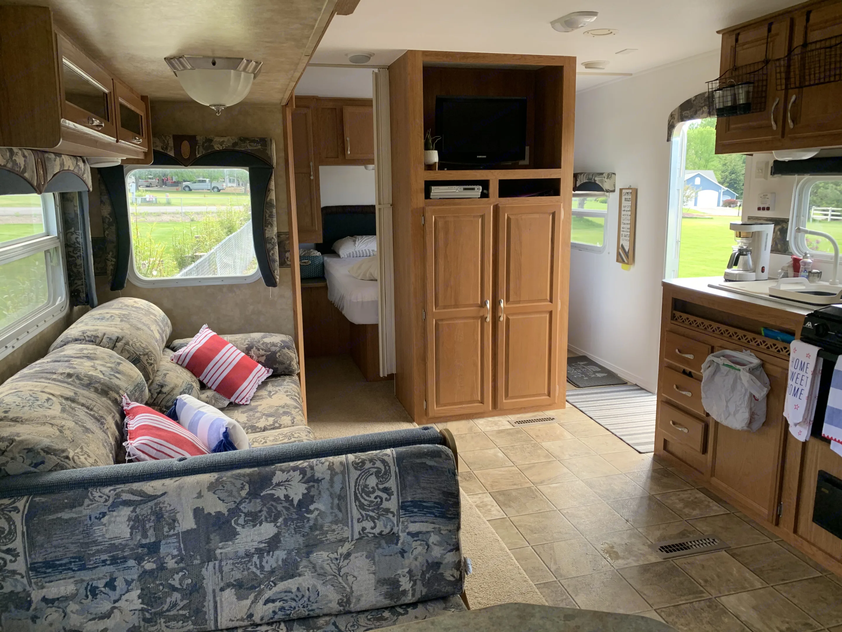The slide out makes all the difference in extra space for your relaxation time! Looking from the dinette to toward the closet and queen bedroom. . Jayco Jay Flight 2007