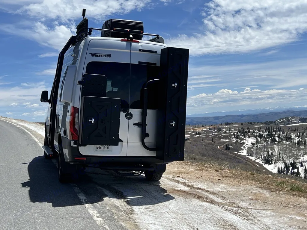 Rear of revel with a ski locker that can hold four pairs of skis with max length of 190cc mounted on the passenger rear door.
. Winnebago Revel 2022