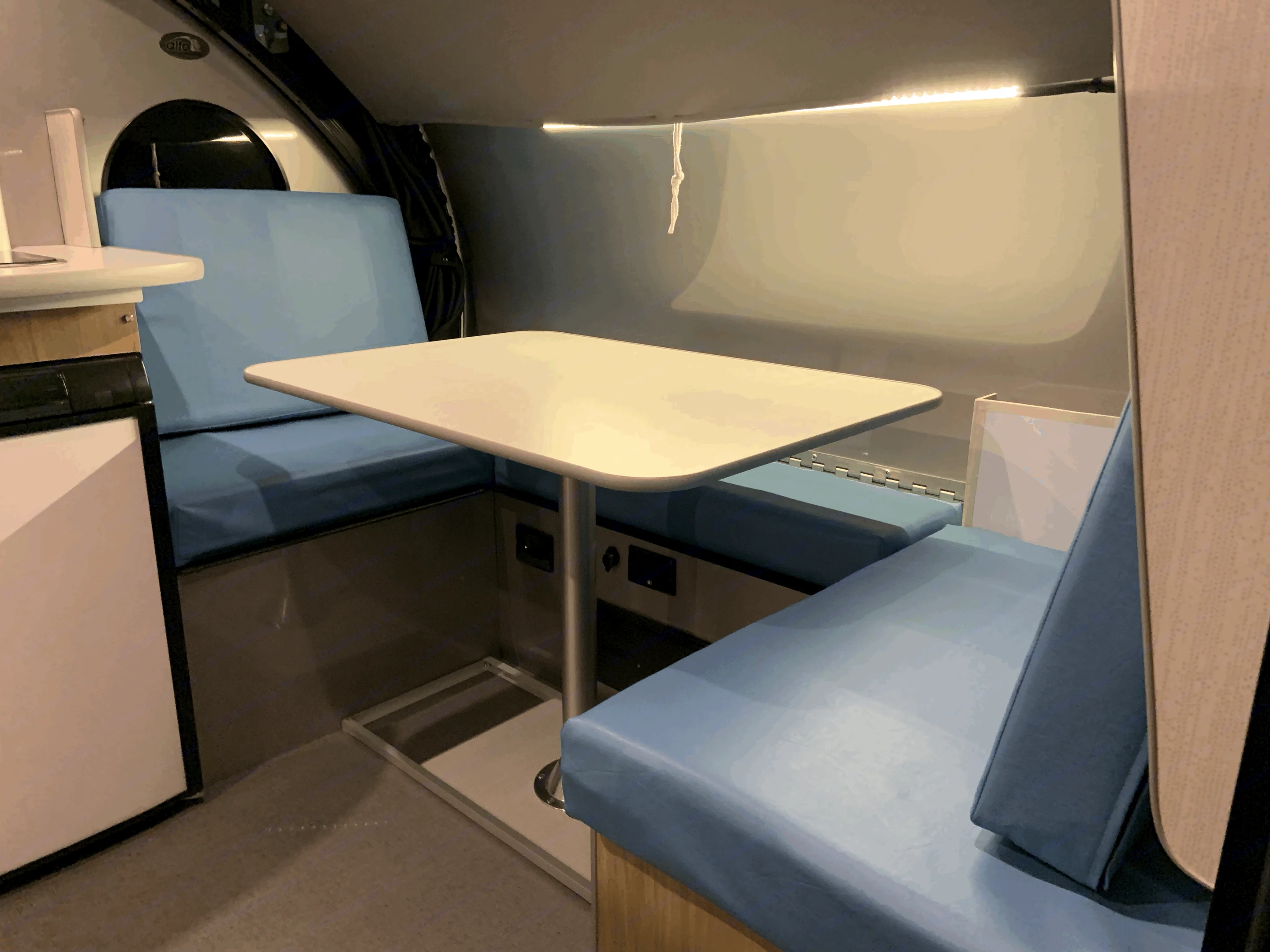 The dinette cushions have been upgraded with sky blue imitation leather. Looks great and super easy to clean up spills!. Safari Condo Alto R1723 Bunkhouse 2022