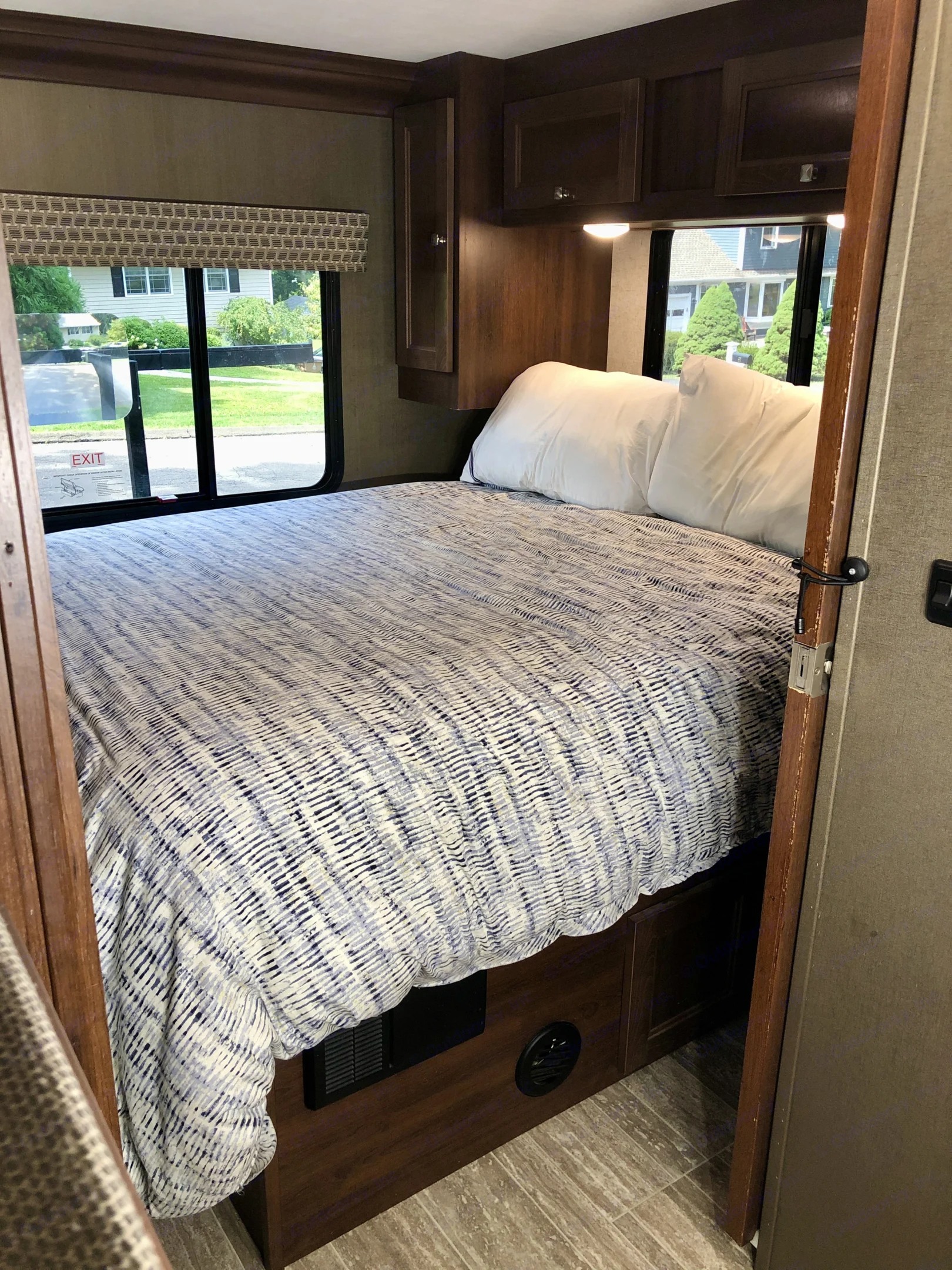 Master bed - Camper Queen - 110v outlets on either side of bed. Forest River Sunseeker LE 2020