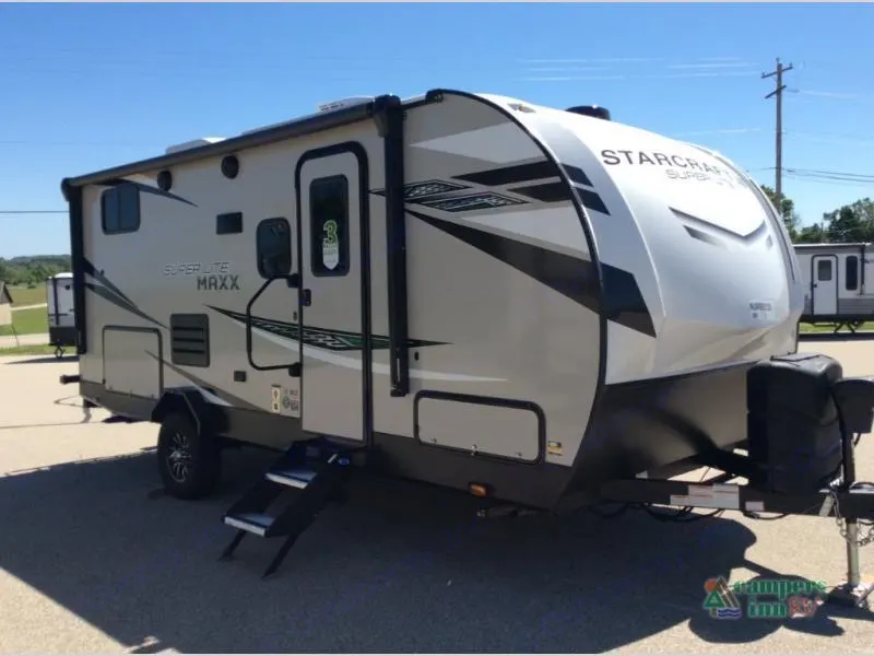 Right side of travel trailer with steps out. . Starcraft Super Lite Maxx 2022