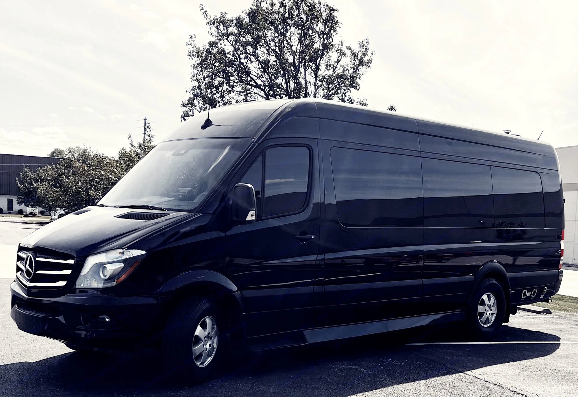 Black Mercedes Sprinter luxury van available for RV rental, ideal for group travel.. Ultimate Toys Ultimate Presidential 2020