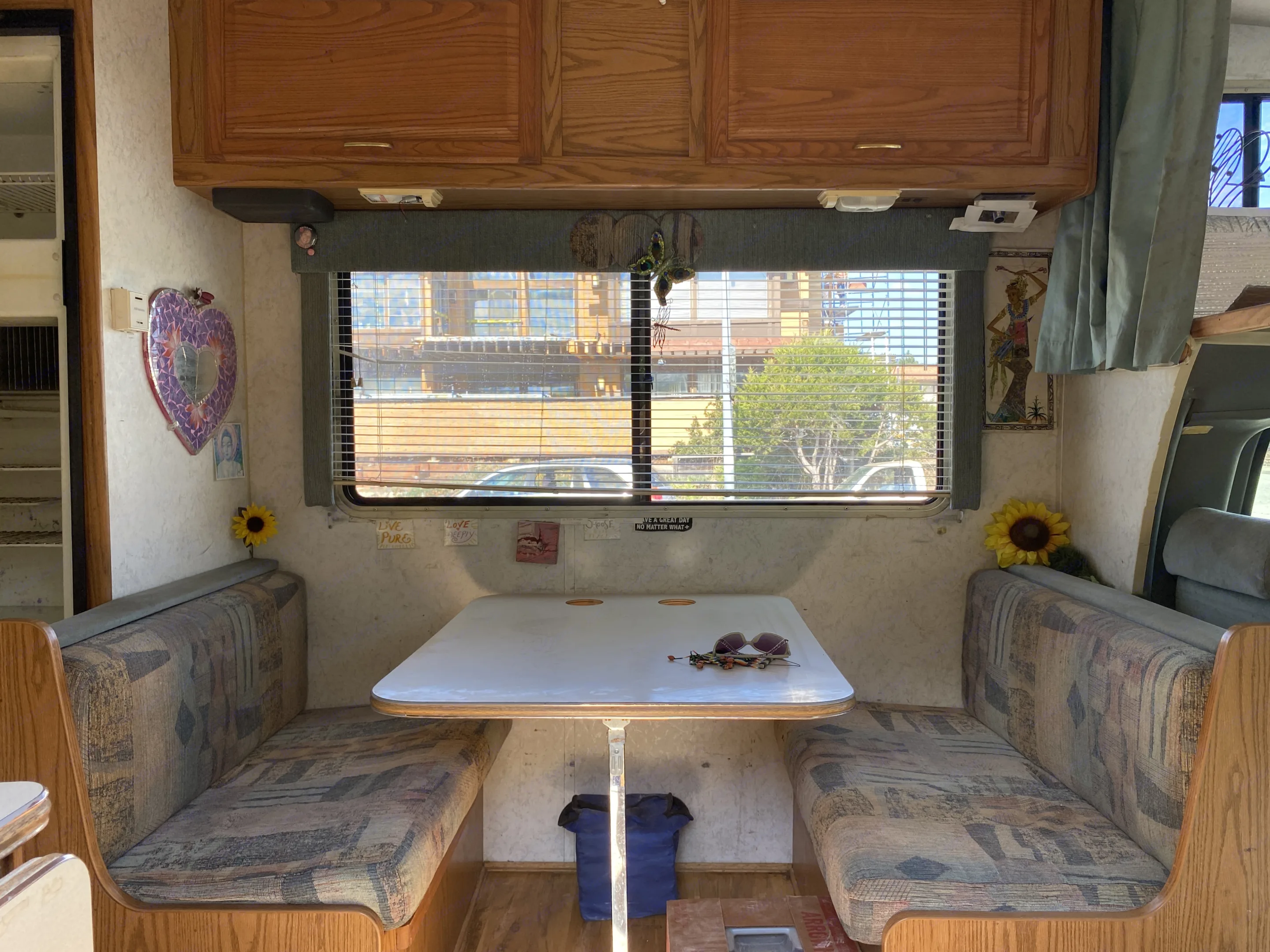 This converts to a bed by lowering the table and repositioning the seat cushions into a sleep mattress . Winnebago Chalet 2000