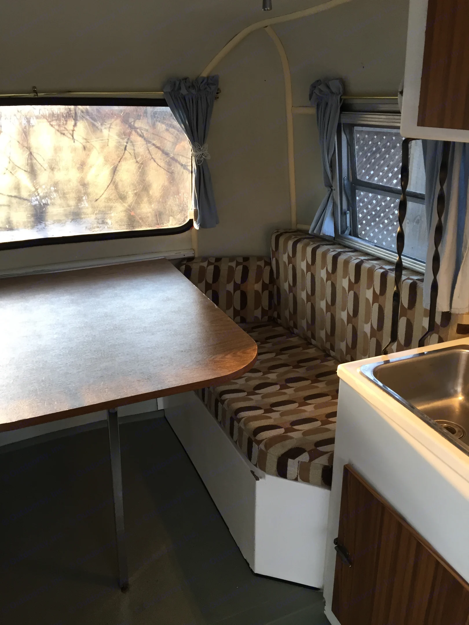 Comfortable seating for 4 adults. Storage under seats. Table lowers for a double bed.. Boler B13 1973
