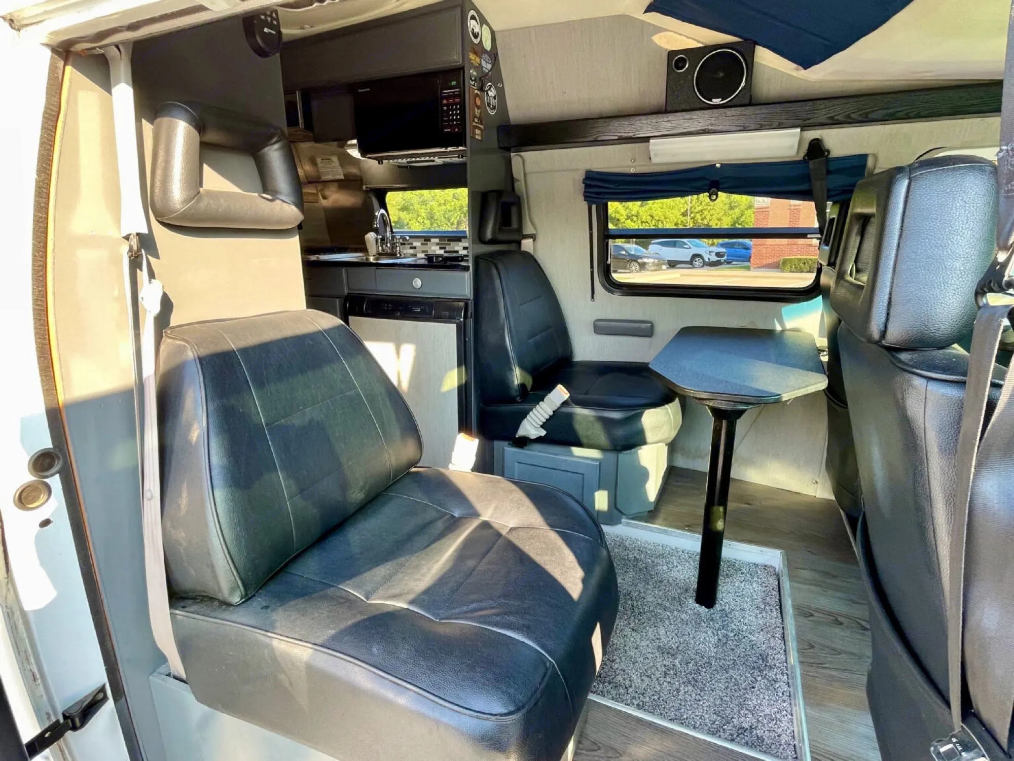 3 or 4 comfy captains chairs; 4th can be removed for paddleboard/snowboard storage. Driver and passenger chairs rotate to create great dining area.. Roadtrek 210 - Popular 1996