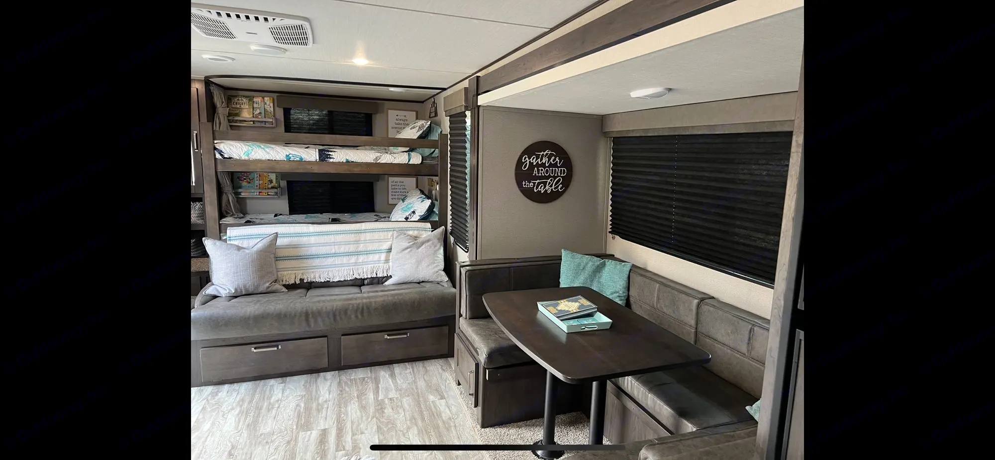 U-shape dinette that converts into sleeping area. Fold out couch and double over double bunks. . Grand Design Transcend Xplor 2021