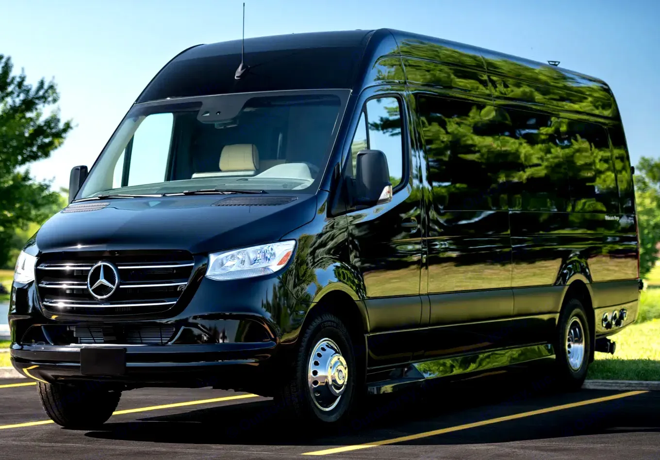 Sleek black Mercedes-Benz Sprinter high-roof van, ideal for rv rental. Parked outdoors on asphalt.. Ultimate Toys Ultimate Coach 2023