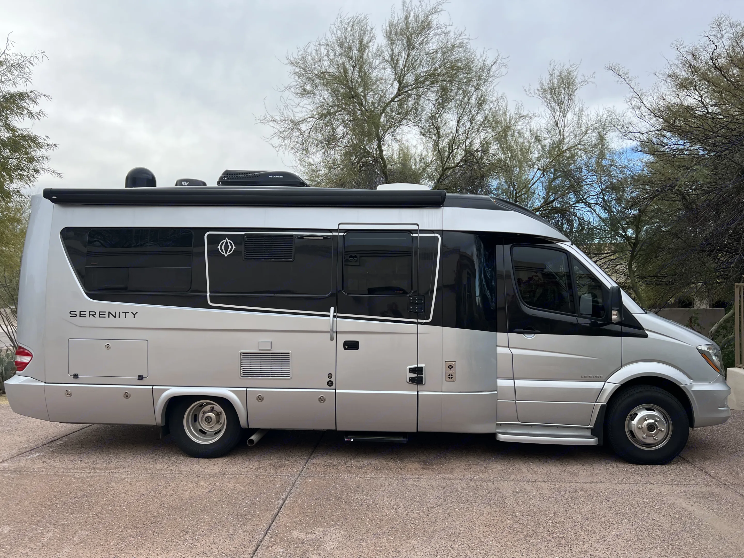 Tons of storage, wind-activated awning, step lights, and the most beautiful shaped and designed RV on the road today!. Leisure Travel Vans Serenity 2019