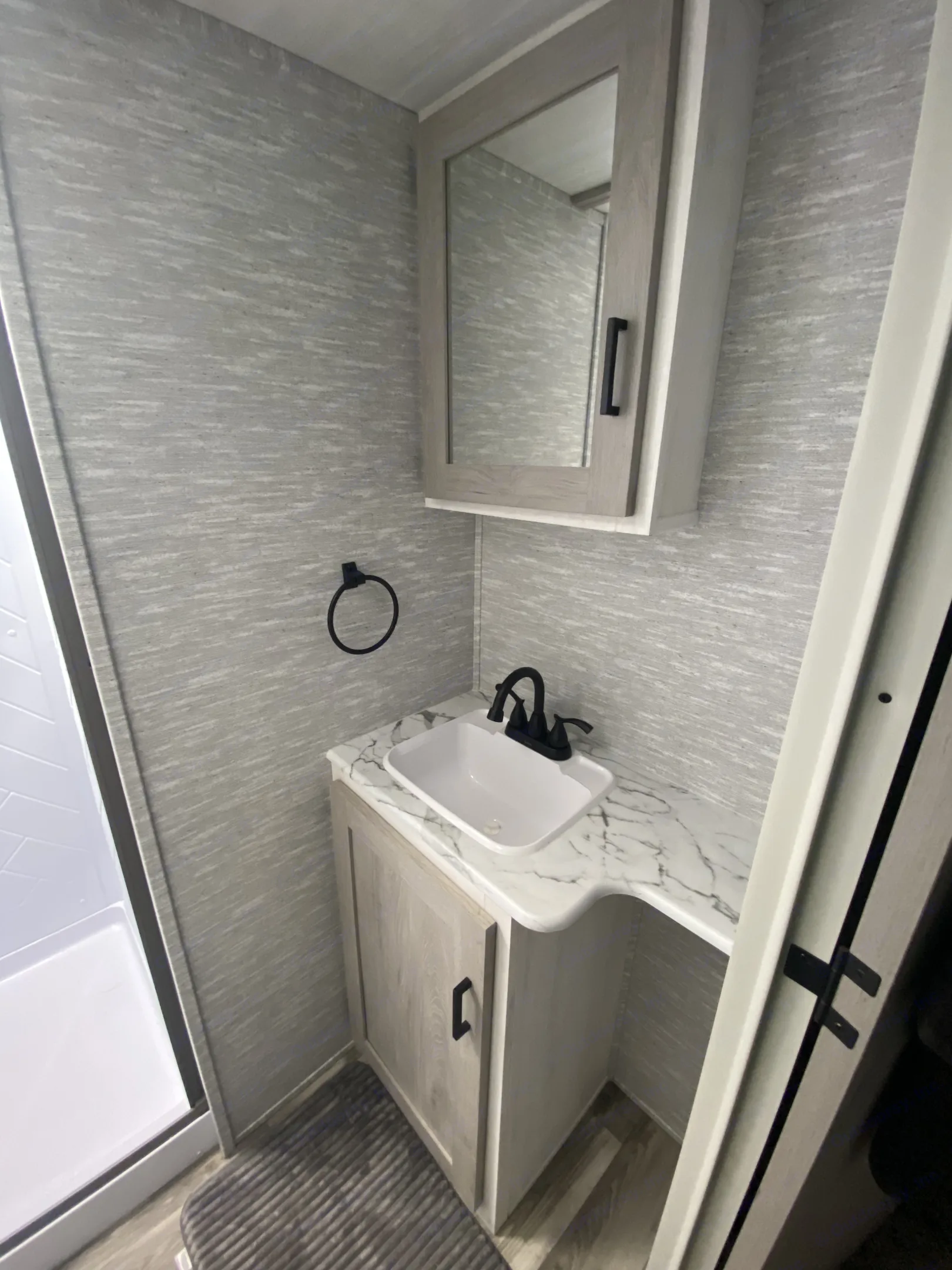 Bathroom with upgraded sink and shower faucets.. Forest River Impression 2021