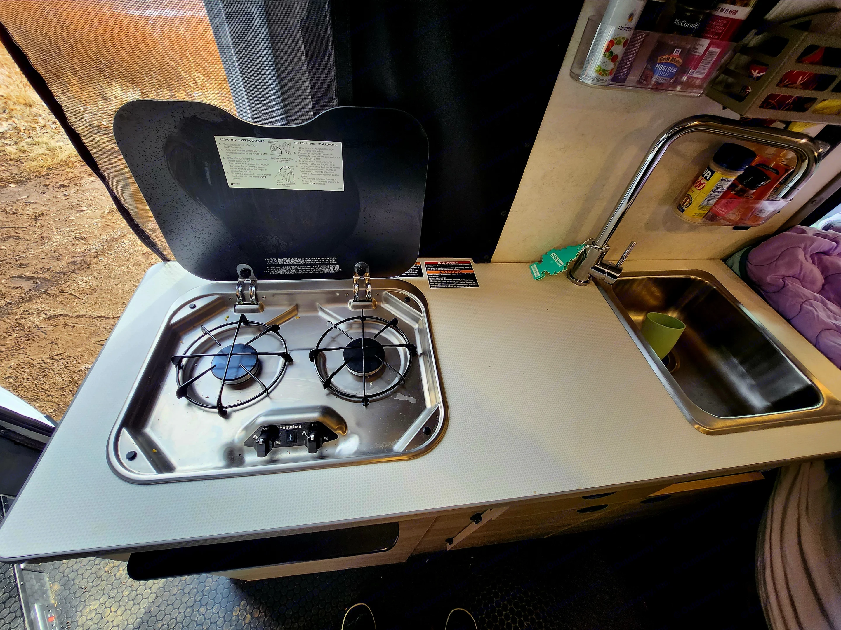 Here is the kitchen, stove, and sink.. Winnebago Solis 2023