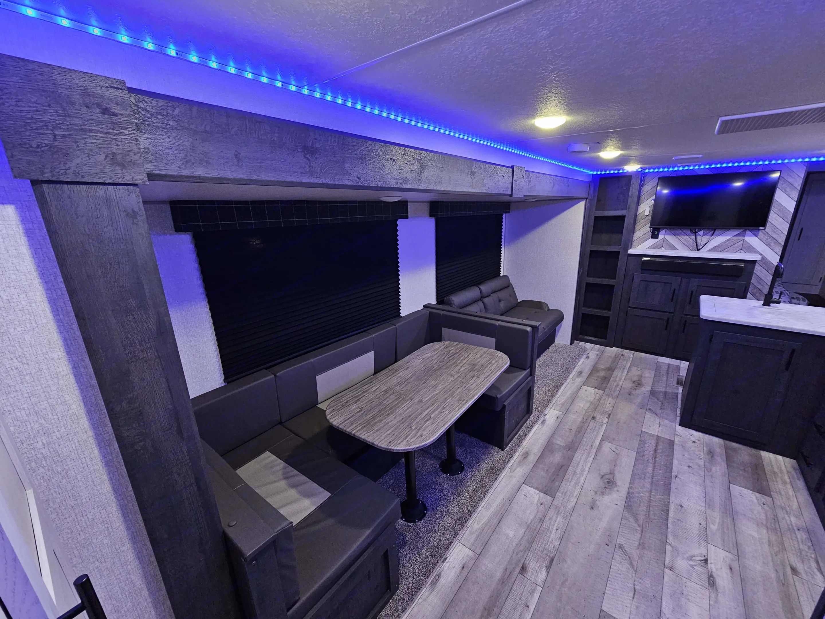 The combination of dining room and couch makes this slide out a luxurious amount of space.. KZ 312 Bunk House 2022