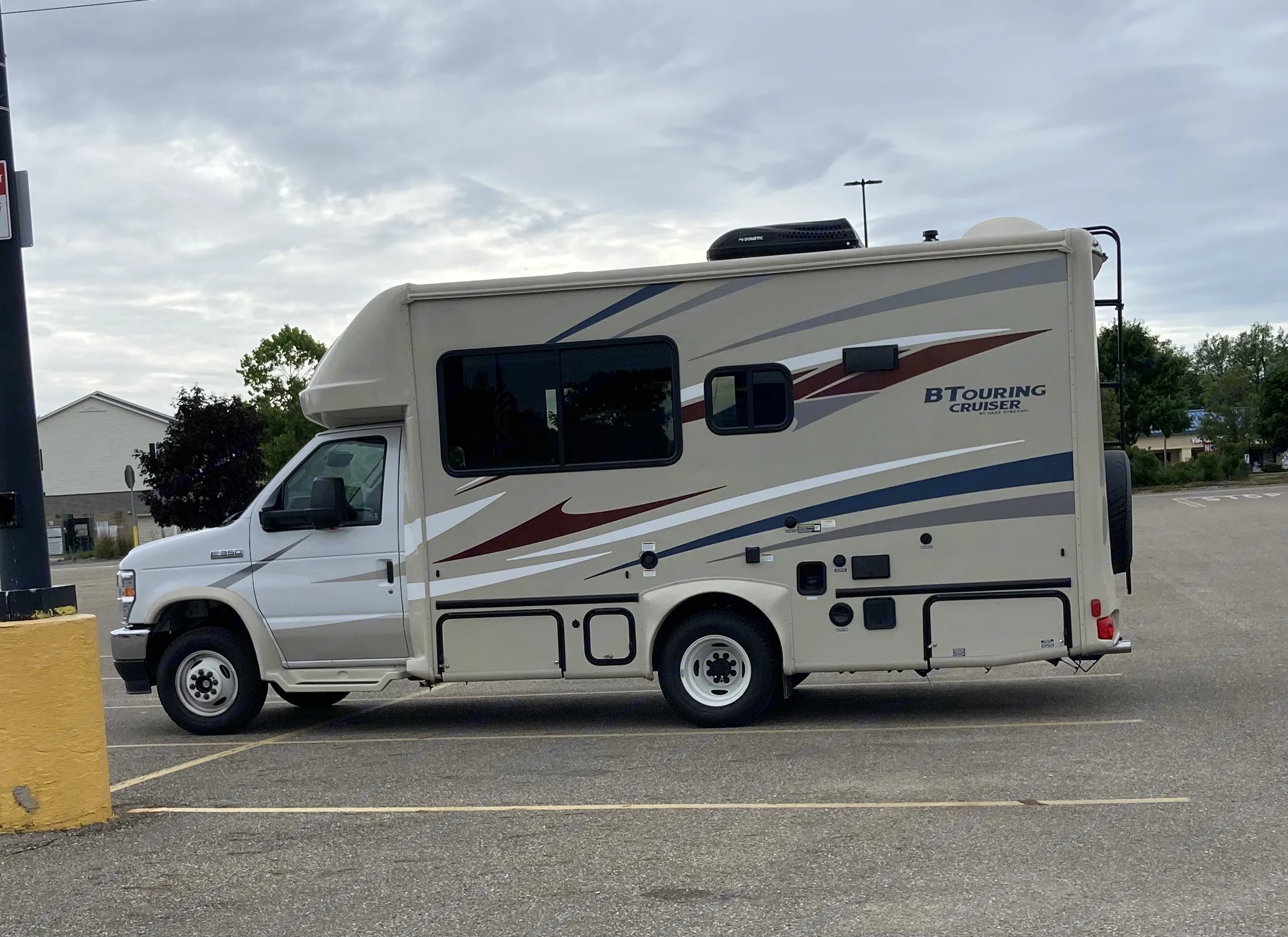 This is my actual vehicle in a parking lot. It is 22’6” and fits width wise in a standard parking space.. Gulf Stream B Touring Cruiser 2022