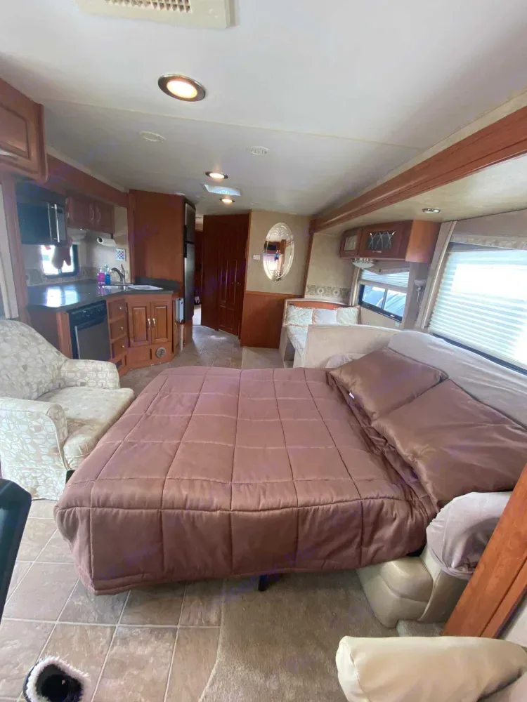 When living room is setup for sleeping there's still plenty of room in front of the kitchen/dining area and don't forget there's 2 private bedrooms.. Georgetown M-379 2009