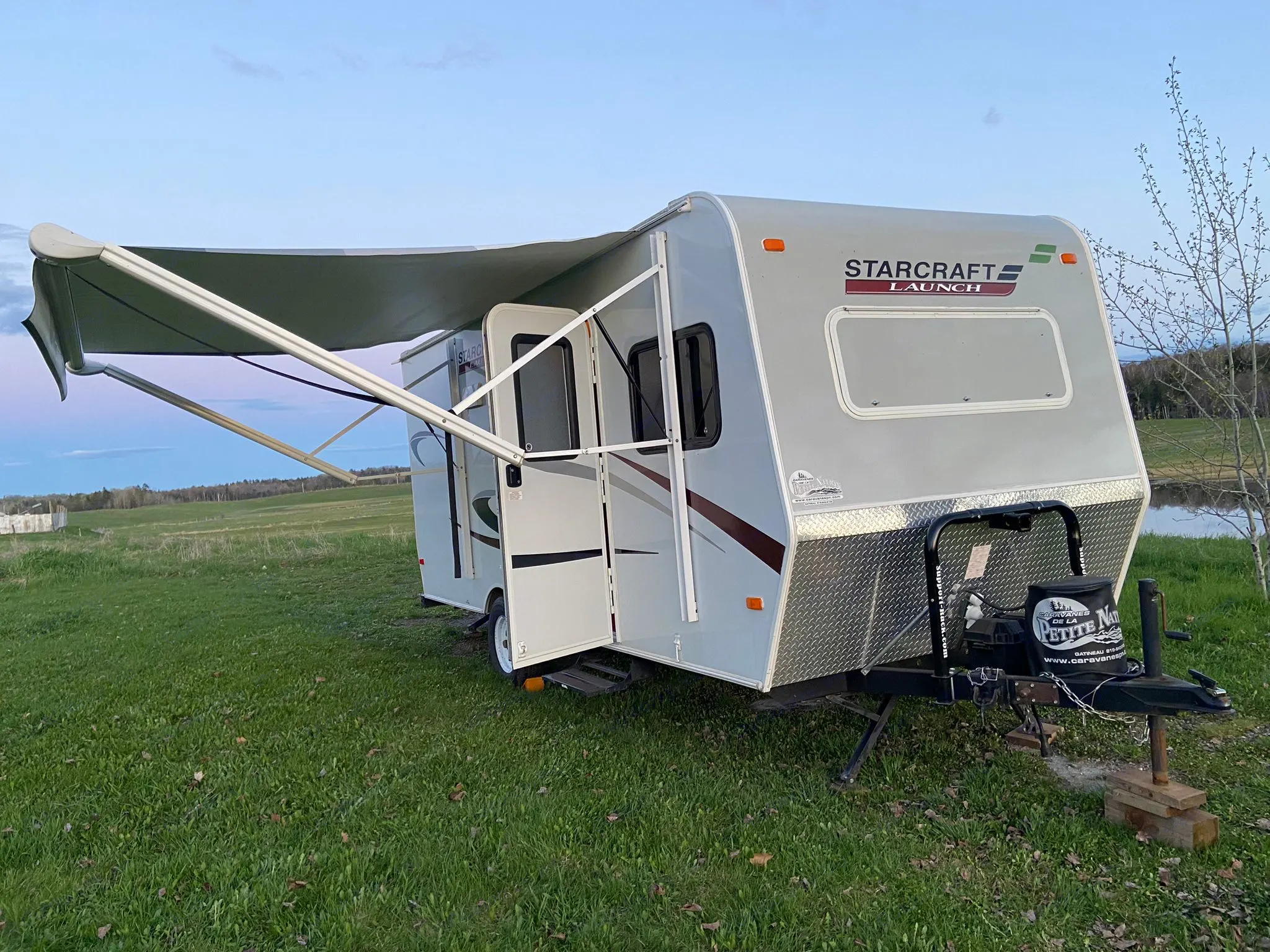 Travel trailer with awning. Starcraft Launch 2013
