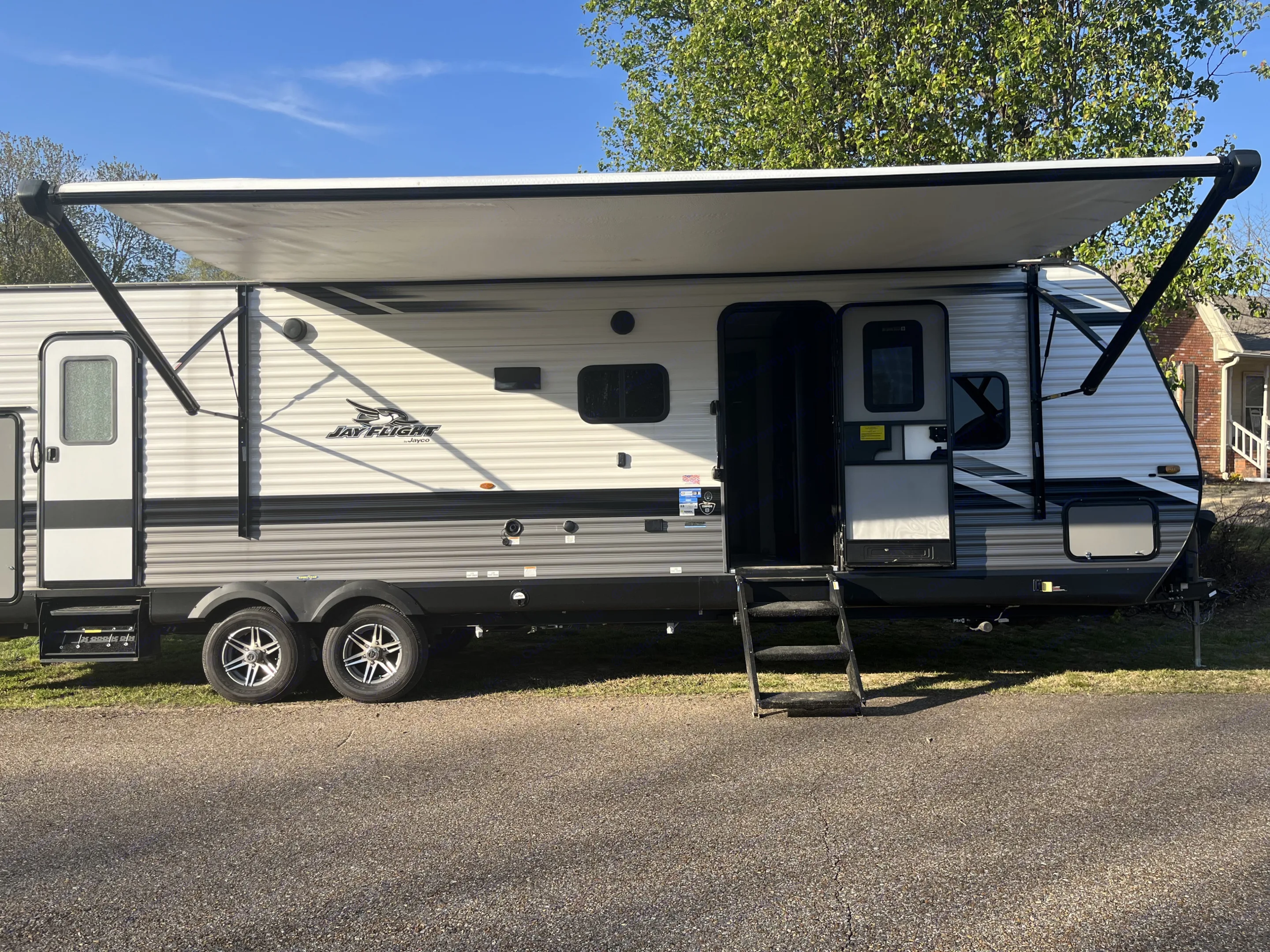 This white and gray Jayco travel trailer RV rental. Jayco Jay Flight 2022