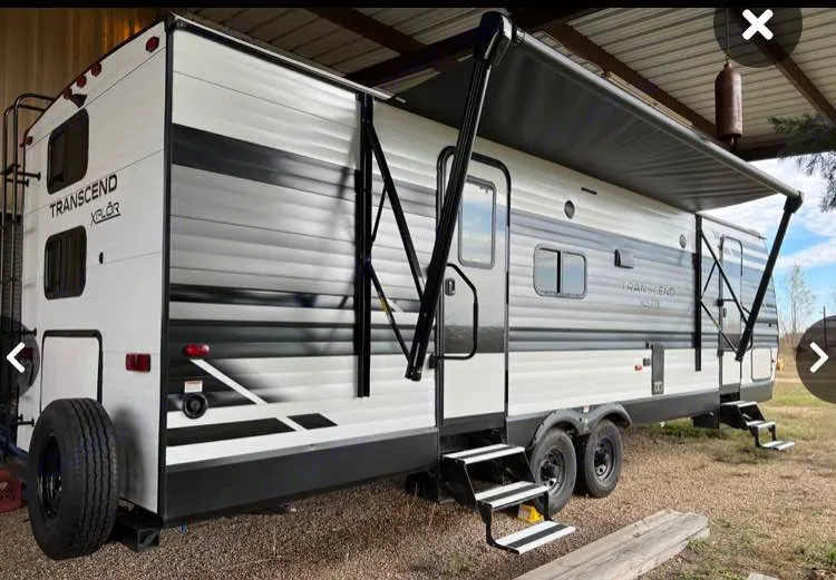 This white and gray Transcend Xplor travel trailer, set up with an extended awning and steps, is ideal for. Grand Design Transcend Xplor 2020