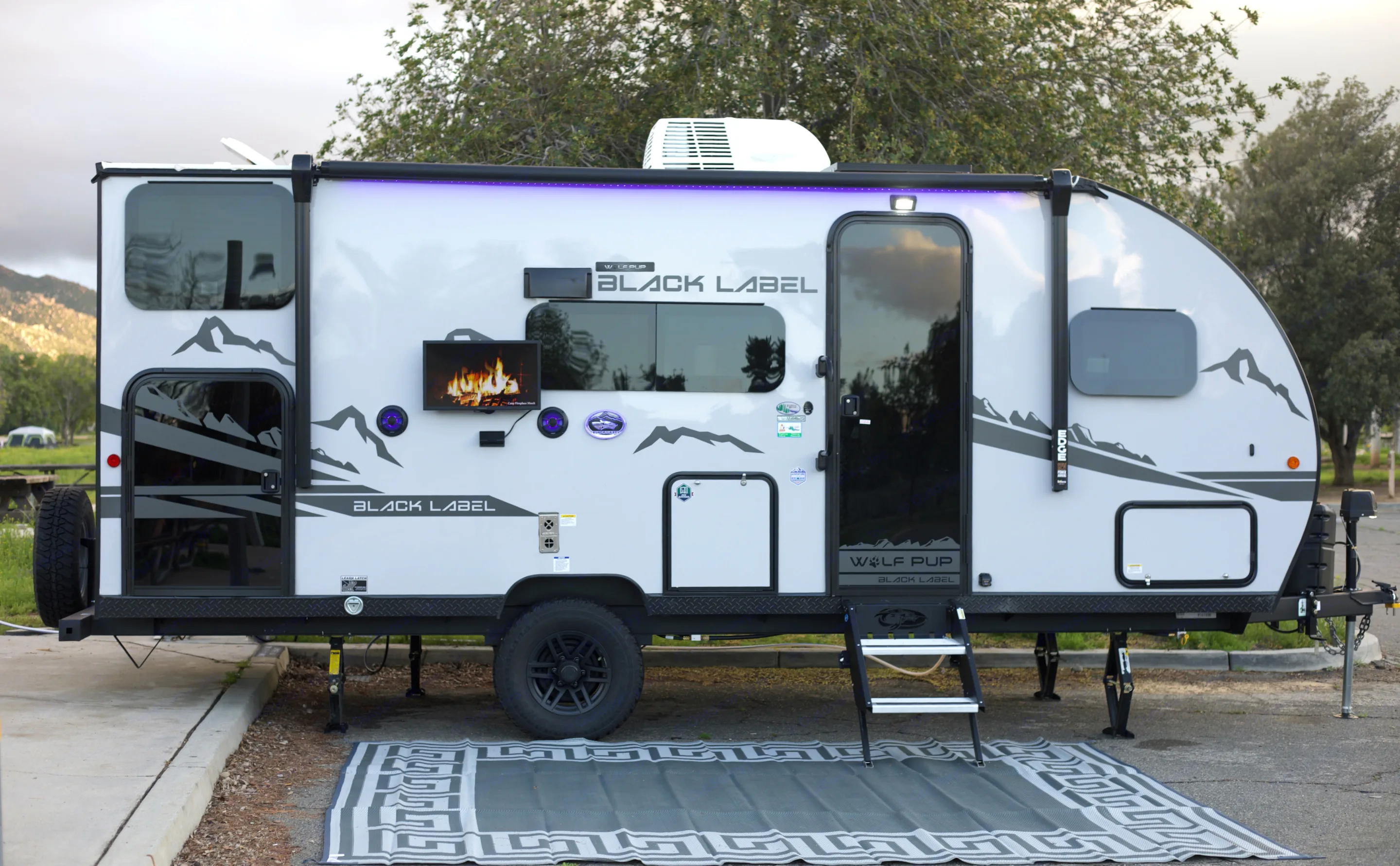 Our beautiful RV offers an outside TV, speakers, mini fridge, outside shower, pet leash latch, and plenty of storage access for all your needs. . Forest River Cherokee Wolf Pup 17JGBL 2023