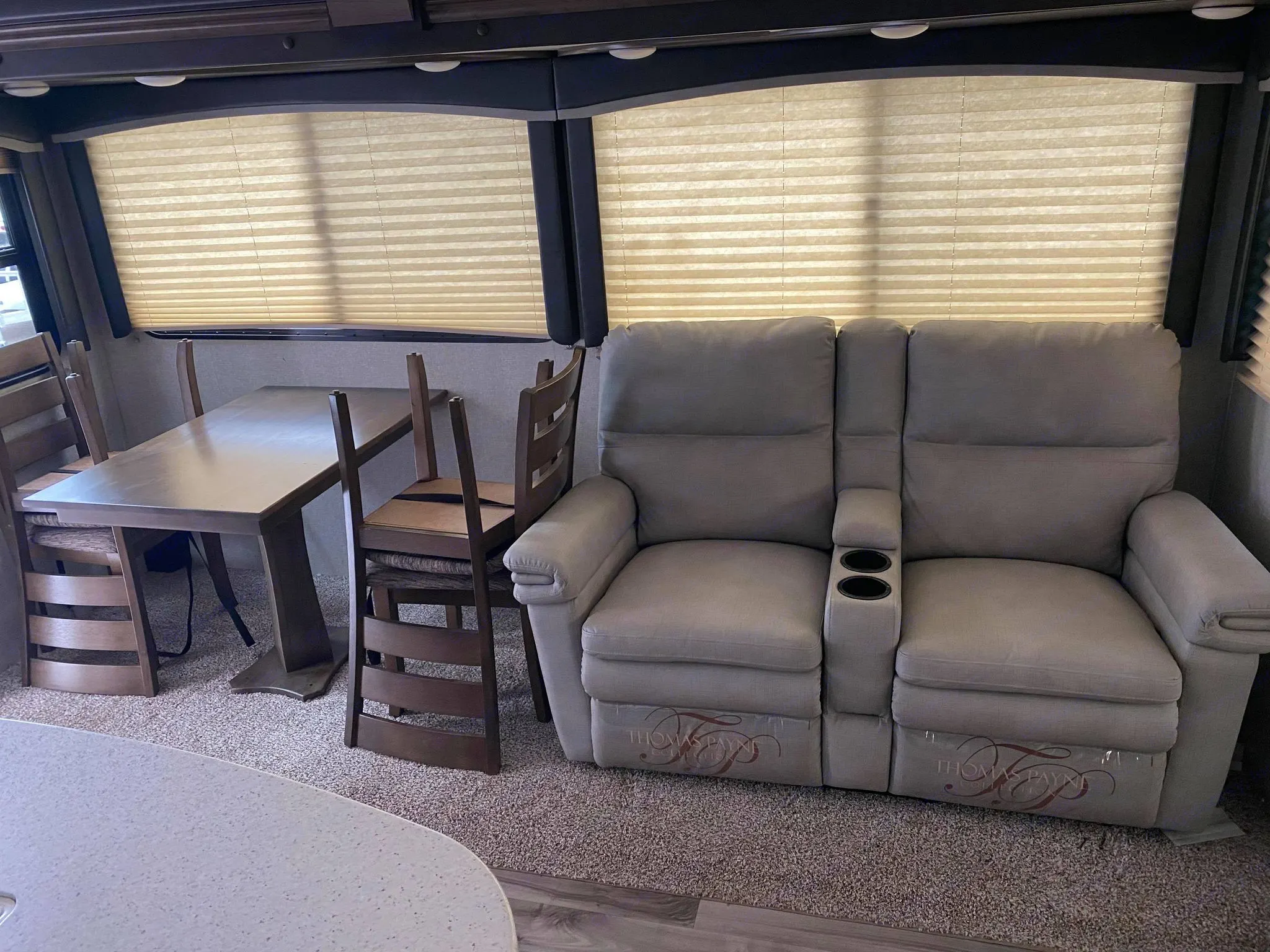 4 Chair dining set and 2 recliners can use to sleep 2 . Keystone RV Cougar 2019
