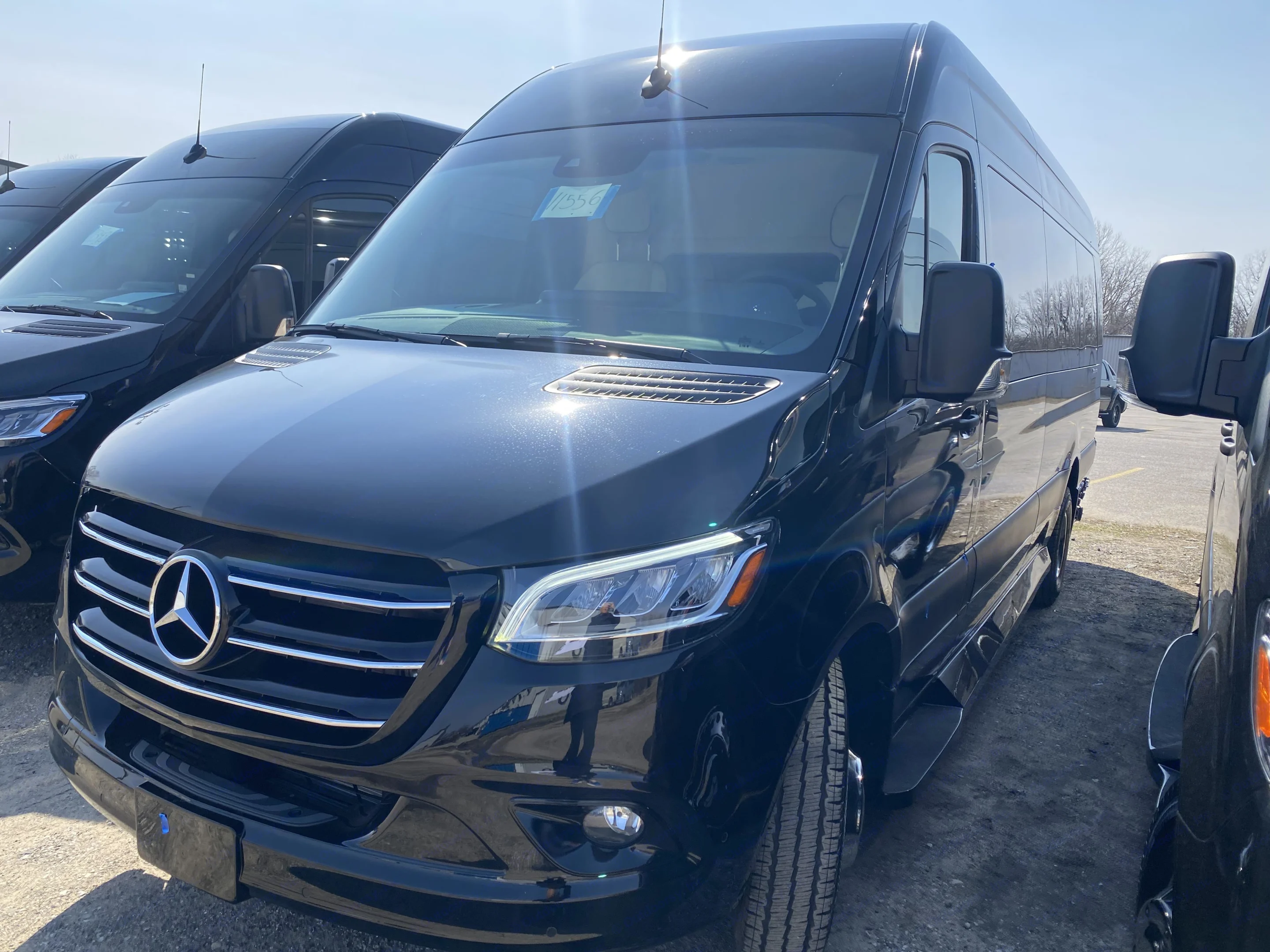 New black Mercedes-Benz Sprinter van, perfect for RV rental or travel, in a bright outdoor lot.. Ultimate Toys Ultimate Cruiser 2024