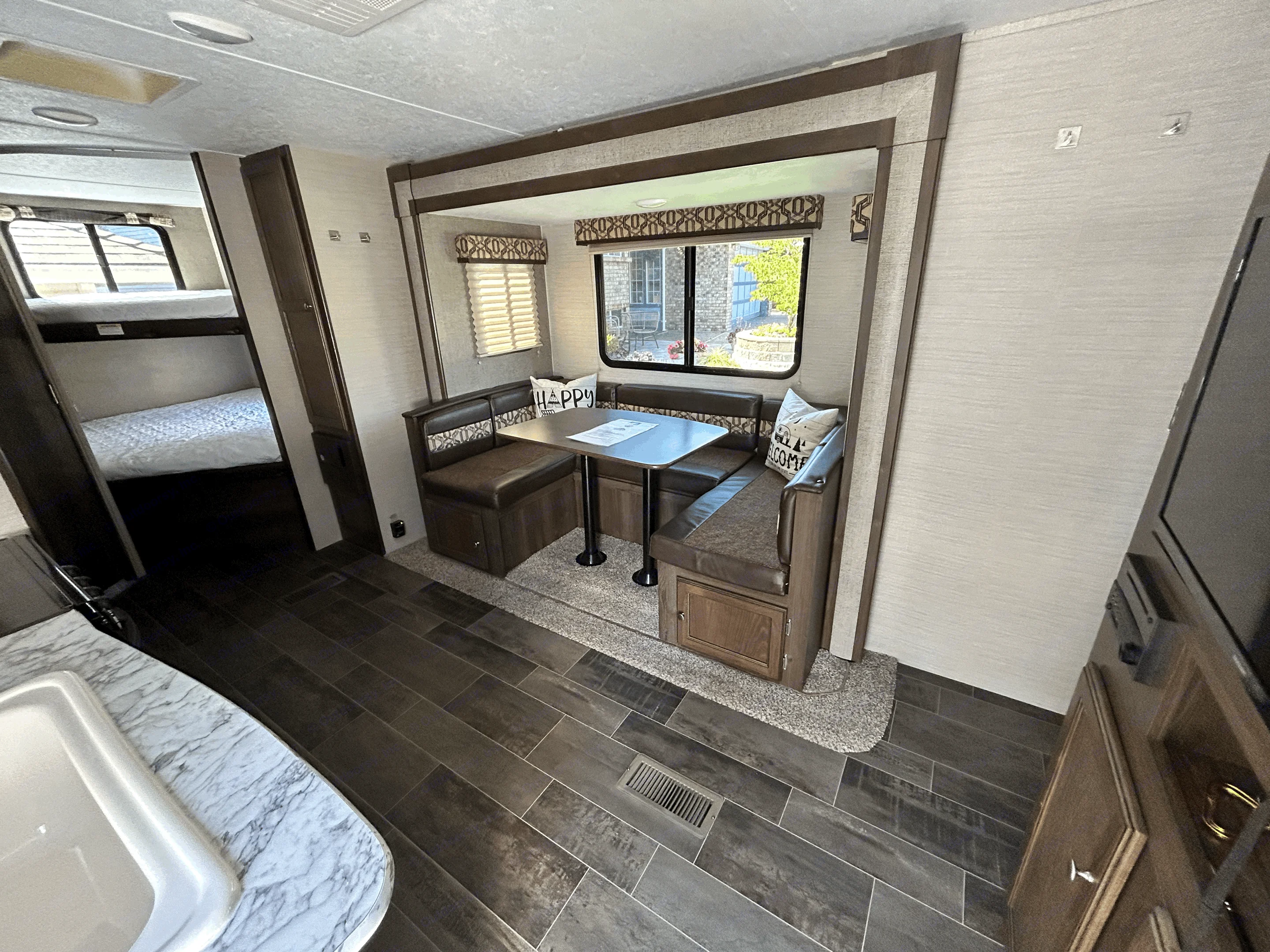 View from front door looking towards the bunk beds and dinette (this also converts into a double bed). Keystone RV Other 2018