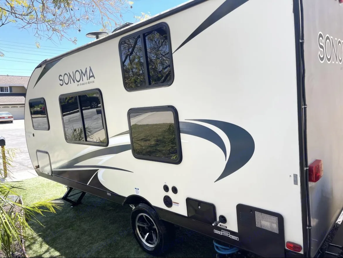 Outdoor shower, city water hook up, waste water connections. Forest River Sonoma 2019