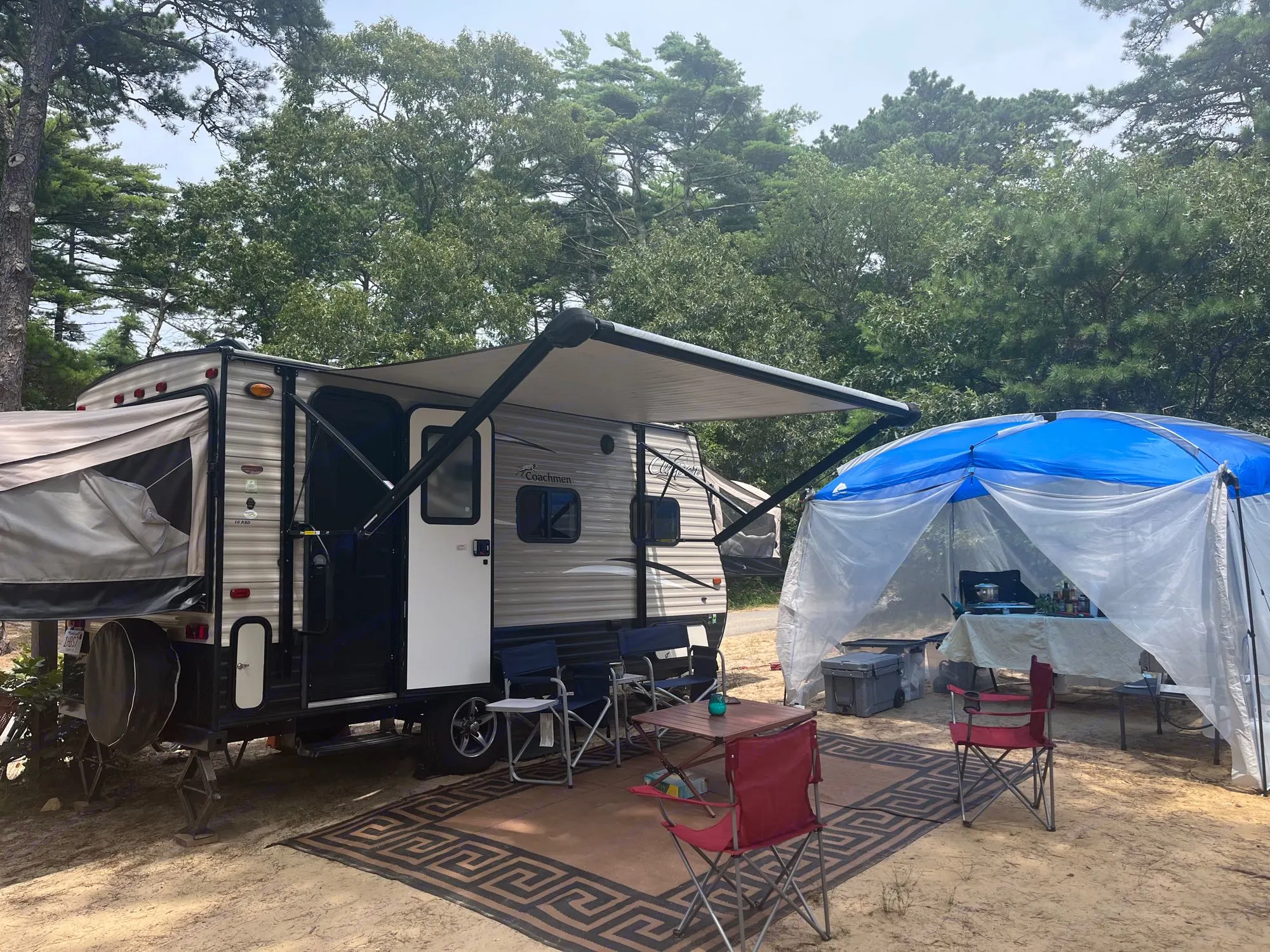 Camp setup with included chairs, outdoor rug and table. Screen house and kitchen are add-ons. . Coachmen Other 2017