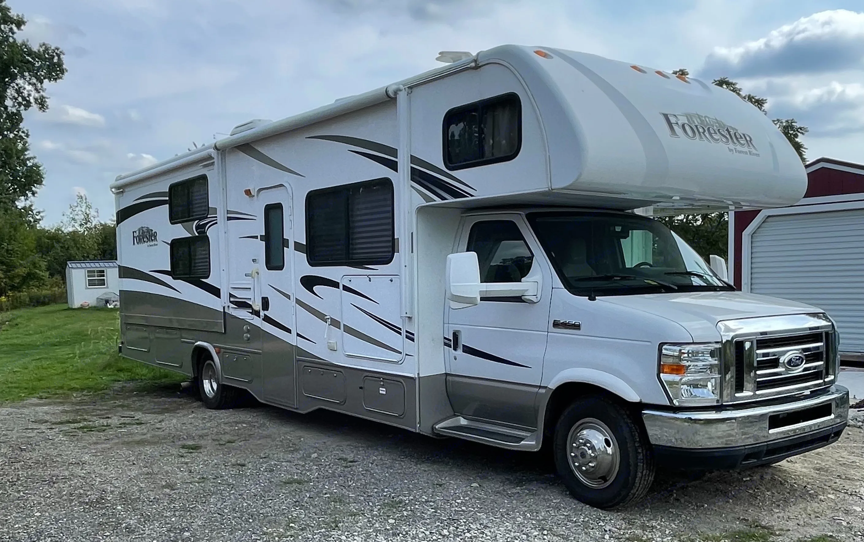 RV rental: A white and gray Forester Class C motorhome parked on gravel.. Forest River Forester 317DS 2014