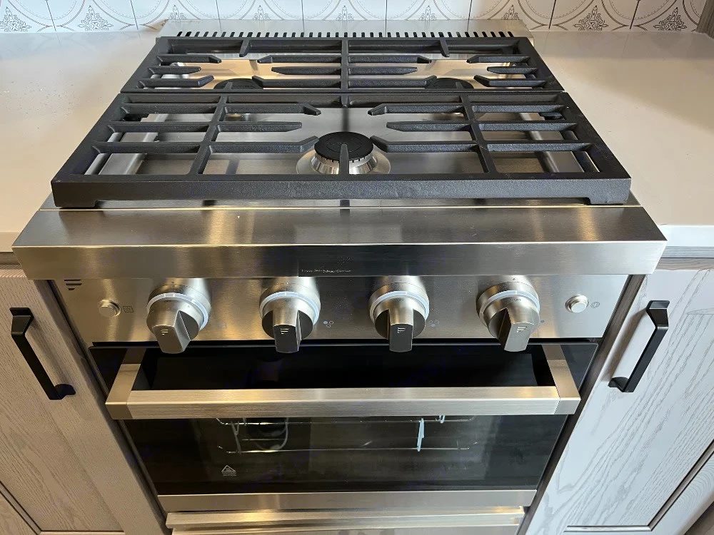 Modern stainless steel gas range & oven provides full cooking capabilities for your RV rental adventures.. Keystone RV Montana High Country 2023