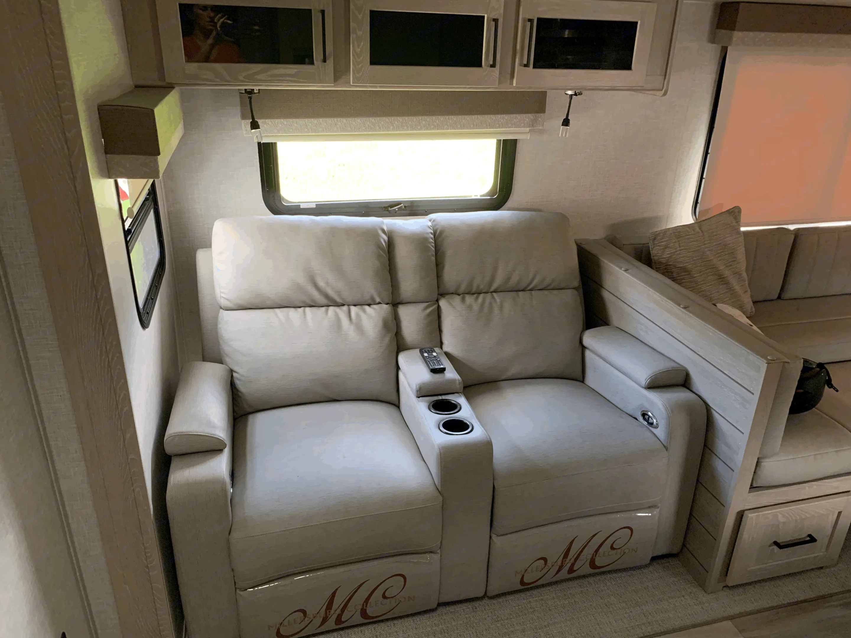 RV rental: Light interior featuring plush recliners with cup holders, remote, and adjoining dinette area.. Forest River Flagstaff Super Lite 2023
